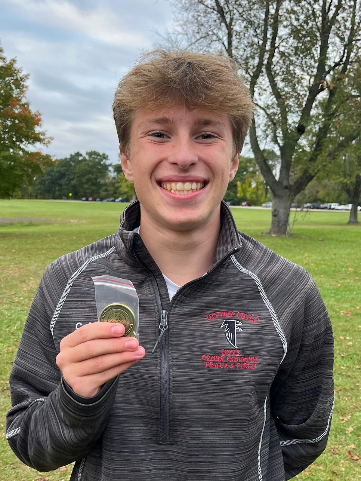 Dearborn Divine Child junior Colin Murray was the individual champion, winning the five-kilometer race at Kensington Metropark’s Possum Hollow course on Oct. 11. (Photos courtesy of the Catholic High School League)