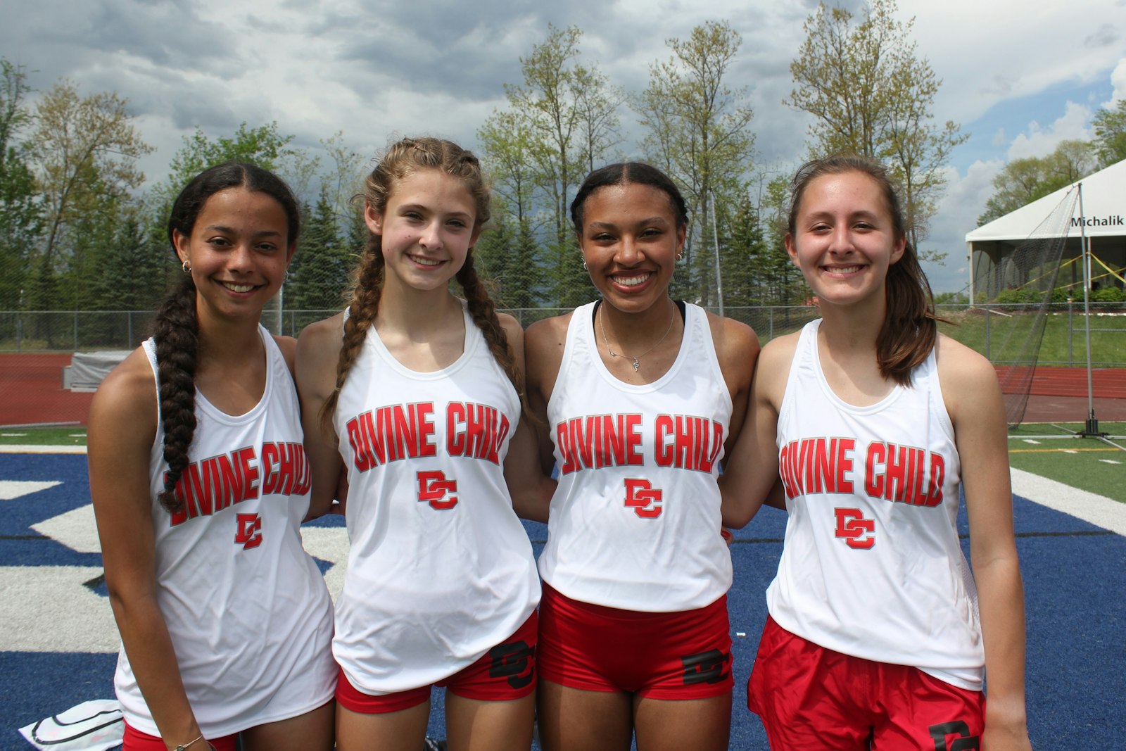 Dearborn Divine Child’s Samantha Black, Katie Kurtinaitis, Lianna Shakoor and Kirsten Koss finished first in the Division 2 4x400m relay with a time of 4:00.83. (Photo by Wright Wilson | Special to Detroit Catholic)