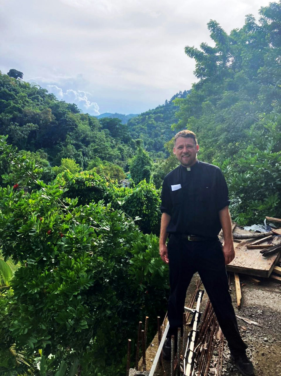 Fr. Adams is pictured in the Jamaican wilderness. After Fr. Adams realized his vision for an oratory in Detroit was unlikely to come to fruition any time soon, he decided to visit the oratory in Jamaica, and received permission from Archbishop Allen H. Vigneron in March to enter the postulancy there. (Photo courtesy of Fr. Ryan Adams)