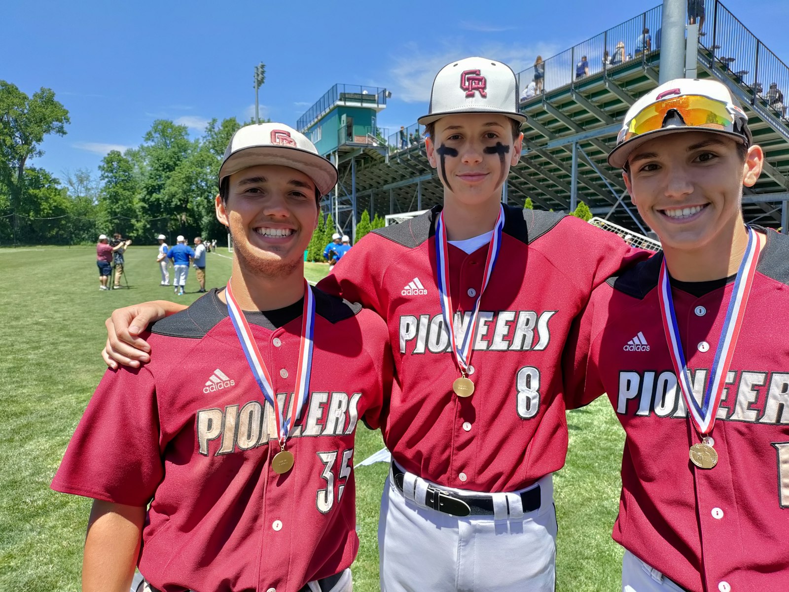 A winning combination: Connor Silka (left) who started the game-winning double play at short, freshman Drew Everingham who came in relief of Ashton Nowak, the winning pitcher, are all smiles about  Gabriel Richard’s Division 4 championship.