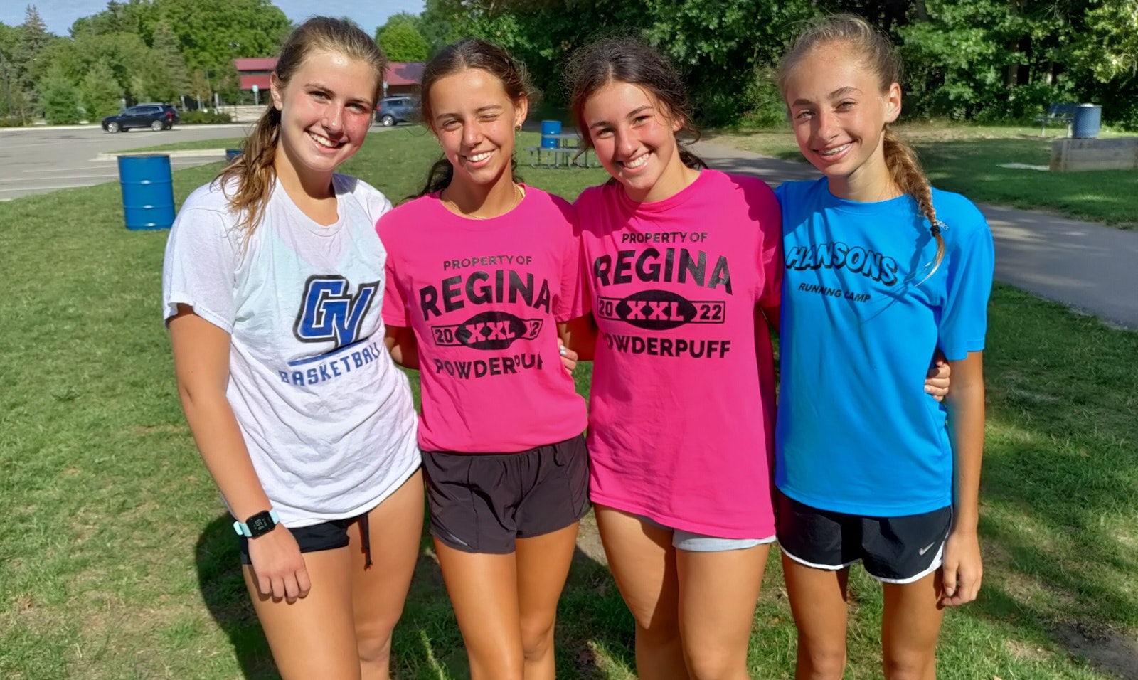 This quartet will be counted on to provide the leadership for the Regina cross country squad: Junior Kennedy Roskopp (left), junior Gabby Fernandez, sophomore Natale Lentine and sophomore Elizabeth Ambroggio. About Coach Golden, Lentine said, “He’s the best coach we can ask for. He knows how to push us to be the best we can be.”