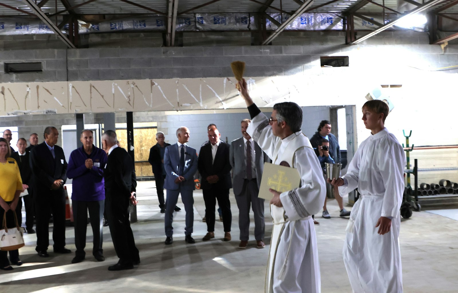 De La Salle alumnus Fr. Brian Meldrum blesses the construction site of the future STEM innovation center at the Warren all-boys school.