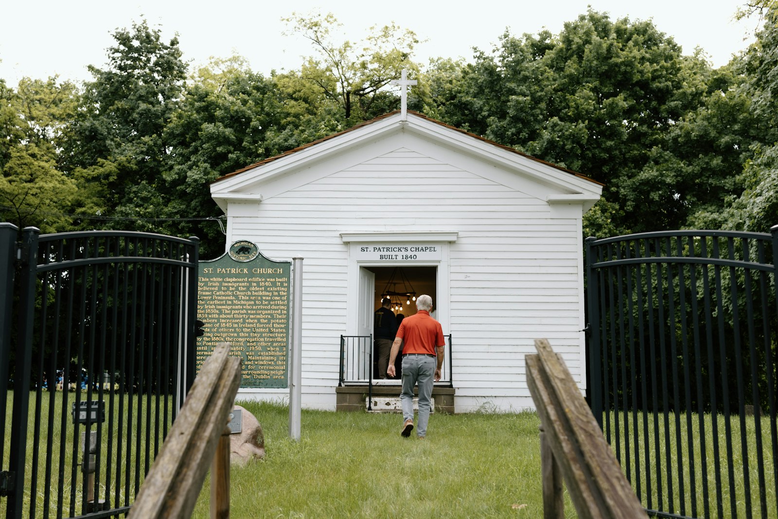 Parishioners of St. Patrick Parish in White Lake file into the small chapel across Union Lake Road for Mass on Memorial Day, May 27, one of two Masses the parish holds each year in the historic chapel.