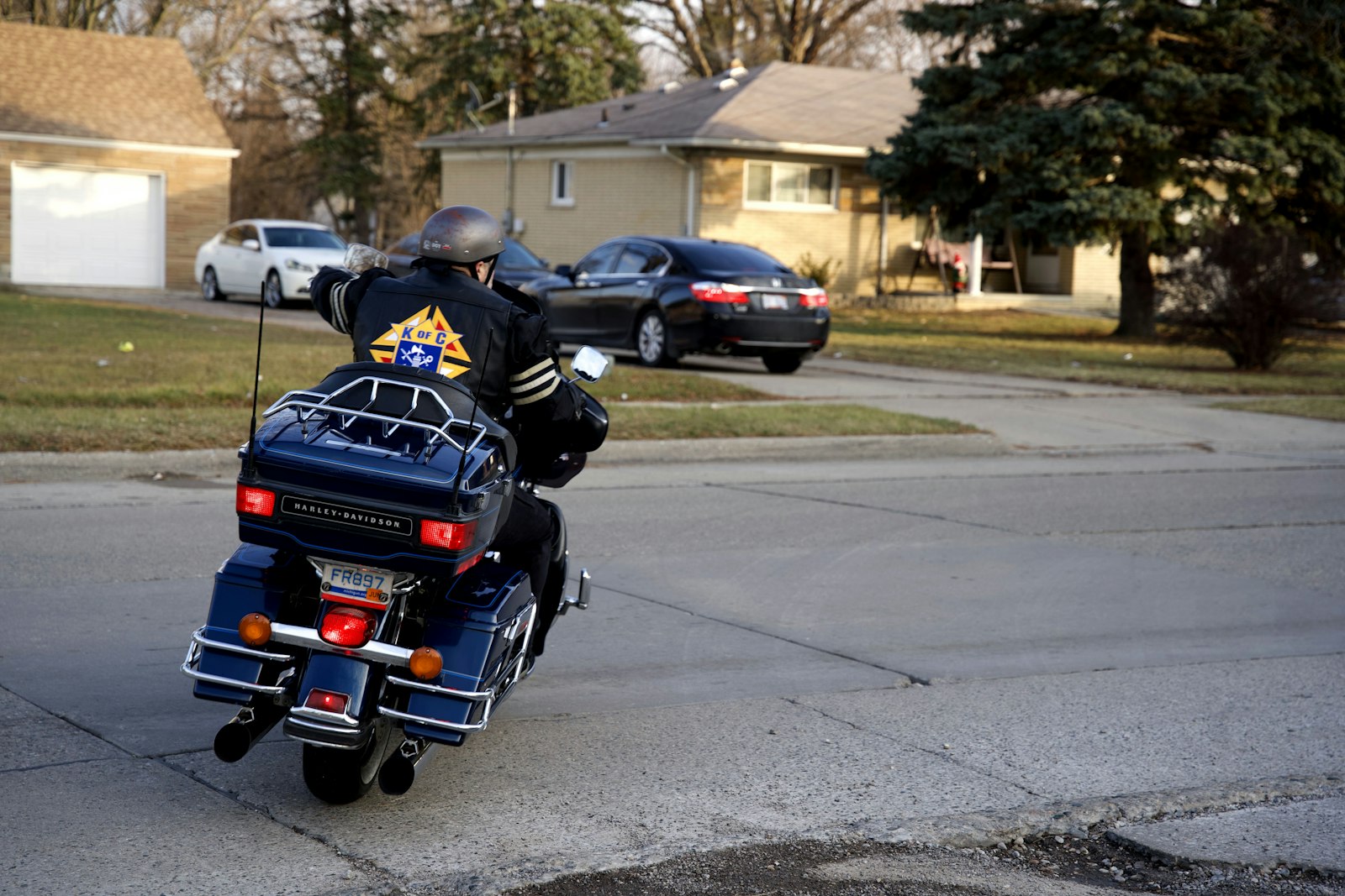 A Knight rides into the sunset after a gathering at St. Mark Parish in Warren. Men have been called upon to provide motorcycle escorts for their fellow Knights of Columbus, and they are preparing to escort Cardinal Raymond Burke for a second time later this year.