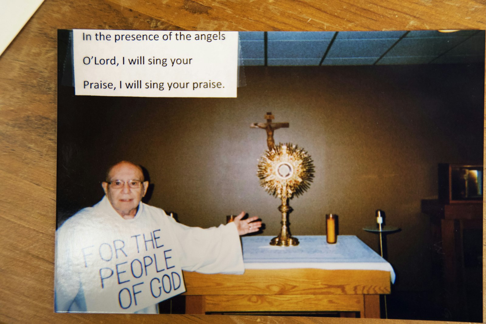 In a recent picture provided by Deacon Delbeke, he stands in front of the altar at St. Edith Parish in Livonia during benediction holding a sign that says, “For the People of God.” It's his way of reminding parishioners that everything God does, especially through the Blessed Sacrament, is for them, he said.