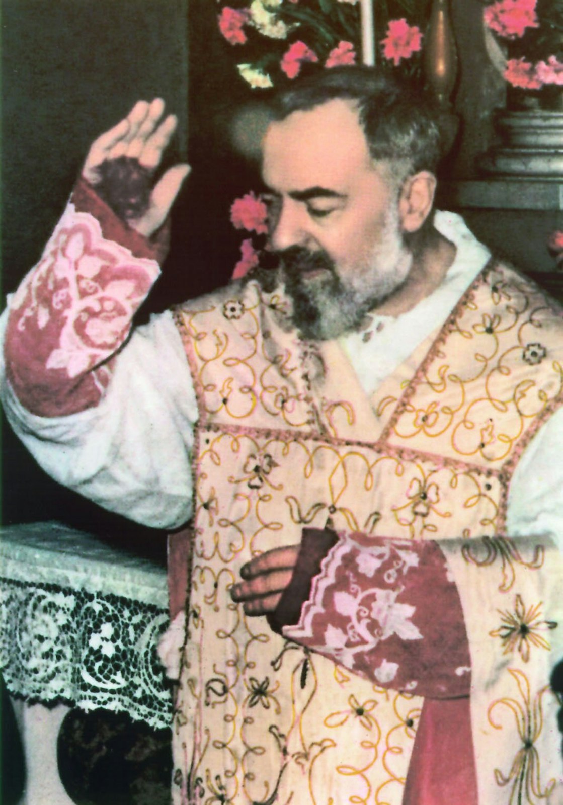 Padre Pio holds up his hand that appears to be bloodied in this undated file photo. During his lifetime, Padre Pio's stigmata was questioned or contested by some church authorities. (CNS file photo)