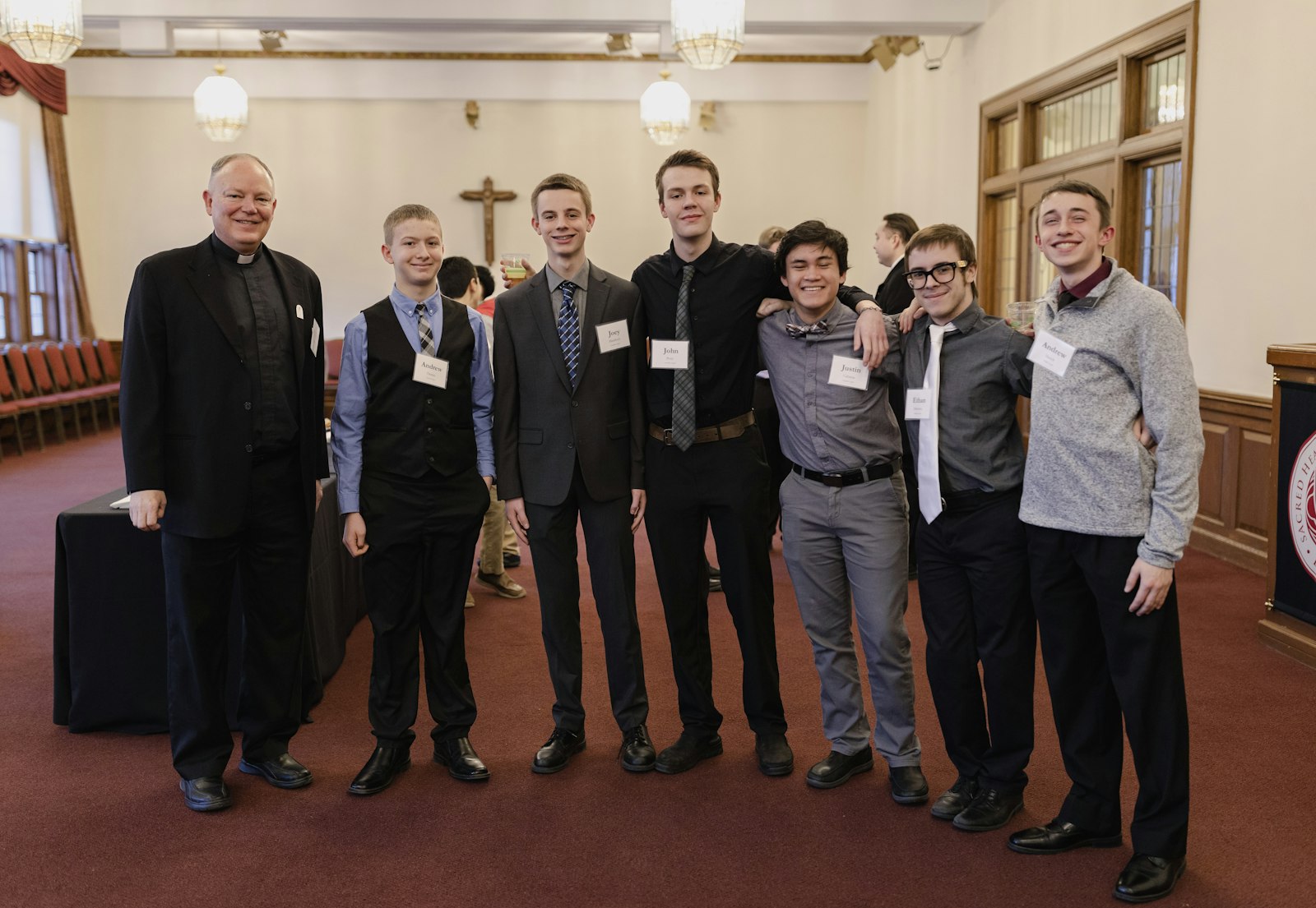 Fr. Tony Richter of Guardian Angels Parish in Clawson stands with the young men of the parish who attended the Feb. 20 evening prayer and dinner at the seminary.