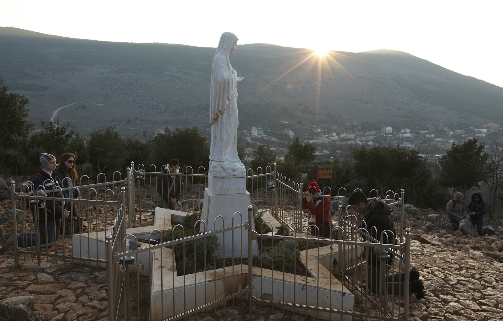 Pilgrims pray around a statue of Mary on Apparition Hill in Medjugorje, Bosnia-Herzegovina, in this 2011 file photo. (CNS photo/Paul Haring)