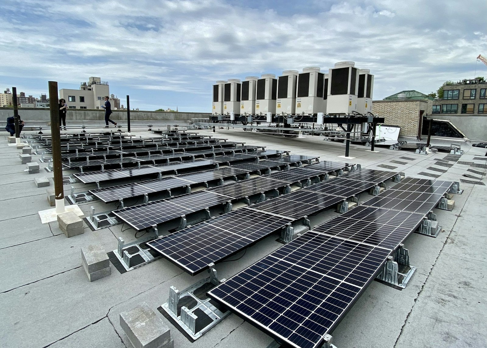Solar panels in New York City are seen atop the Bishop Thomas V. Daily Residence in the Prospect Heights neighborhood of Brooklyn, N.Y. The MIGreen Power Program is a cost-effective way of investing in renewable energy, a DTE spokesman said, because it doesn't require organizations to install expensive small-scale equipment that might otherwise be cost-prohibitive. (CNS photo/Bill Miller, The Tablet)