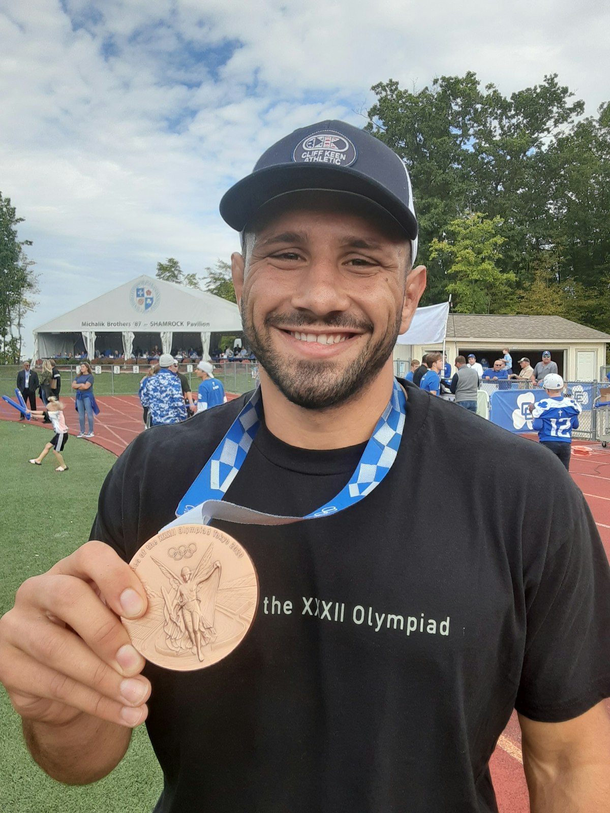 Myles Amine is proud to show off his bronze medal from the Tokyo Olympics, held last August. (Photo by Wright Wilson | Special to Detroit Catholic)