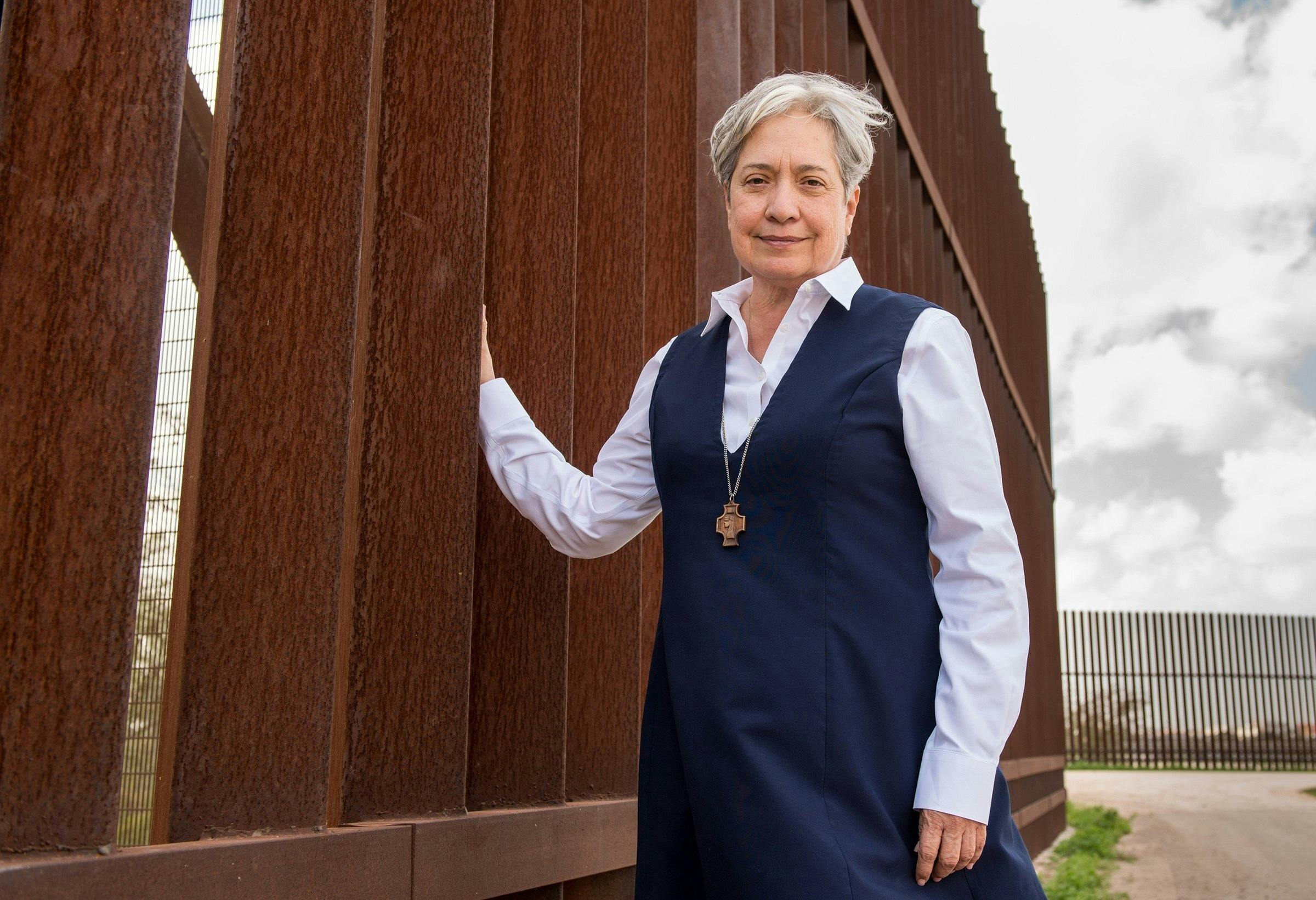 Sr. Norma Pimentel, a member of the Missionaries of Jesus, is pictured along a border wall between Texas and Mexico in late February 2018. As the executive director of Catholic Charities of the Rio Grande Valley in Brownsville, Texas, Sr. Pimentel has become a national symbol of the peacekeeping to which Christians are called in the refugee crisis. (CNS photo/Barbara Johnston, courtesy University of Notre Dame)