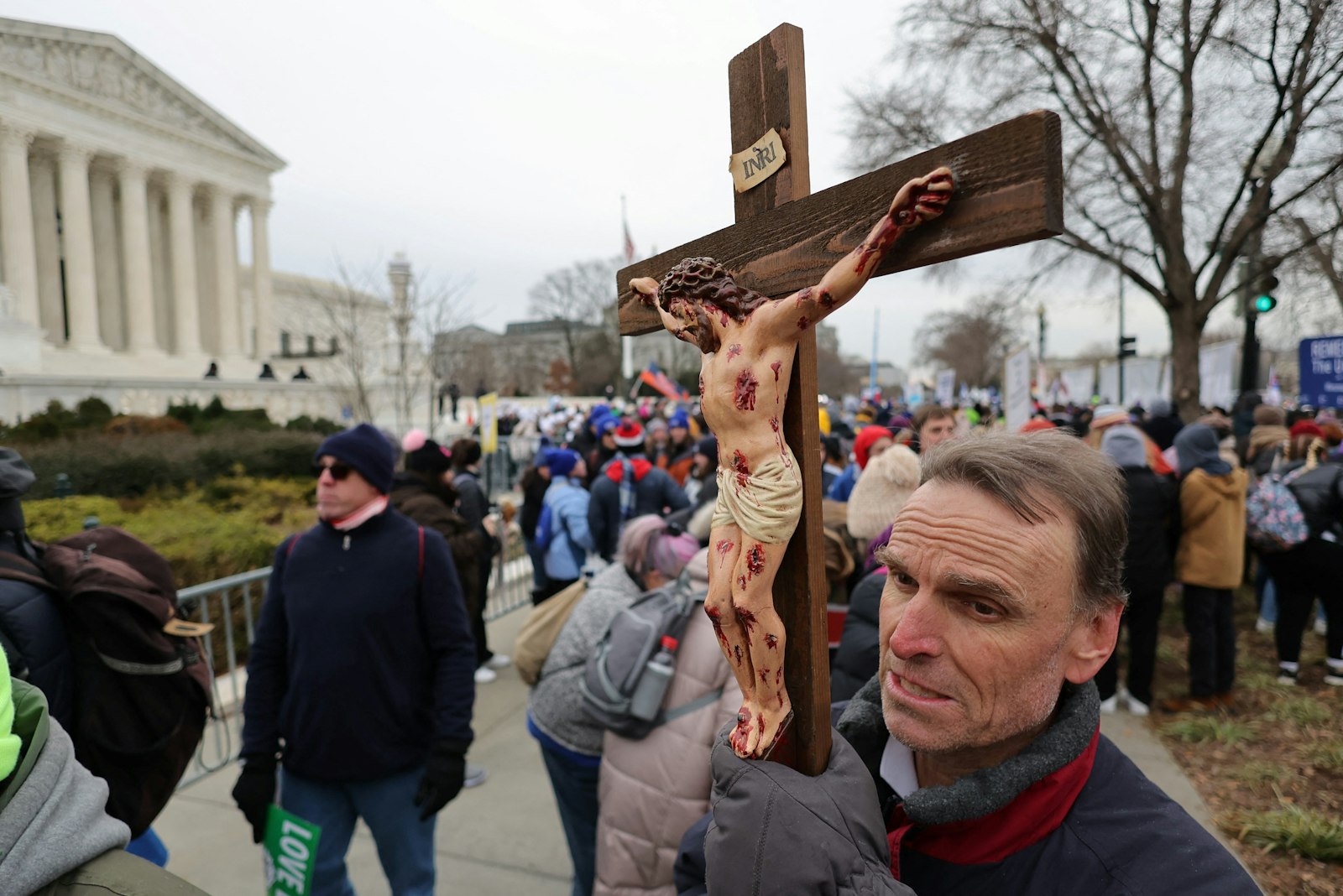 A man carries a crucifix outside the U.S. Supreme Court while participating in the 49th annual March for Life in Washington Jan. 21, 2022. (CNS photo/Jim Bourg, Reuters)