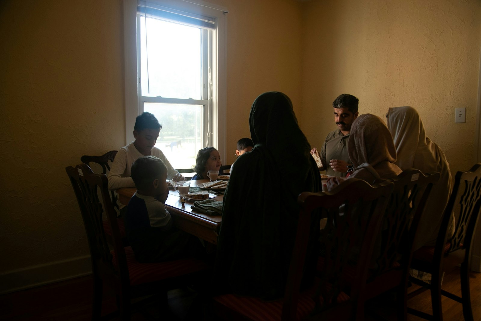 An Afghan refugee family eats breakfast in Bowling Green, Ky., Nov. 2021. (CNS photo/Amira Karaoud, Reuters)