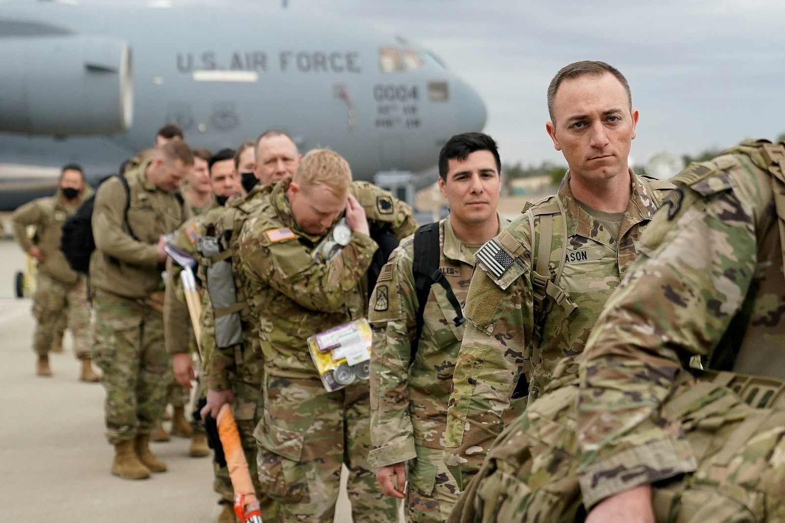 Military personnel from the 82nd Airborne Division and 18th Airborne Corps in Fort Bragg, N.C., board a C-17 transport plane for deployment to Eastern Europe Feb. 3, 2022, amid escalating tensions between Ukraine and Russia. (CNS photo/Bryan Woolston, Reuters)