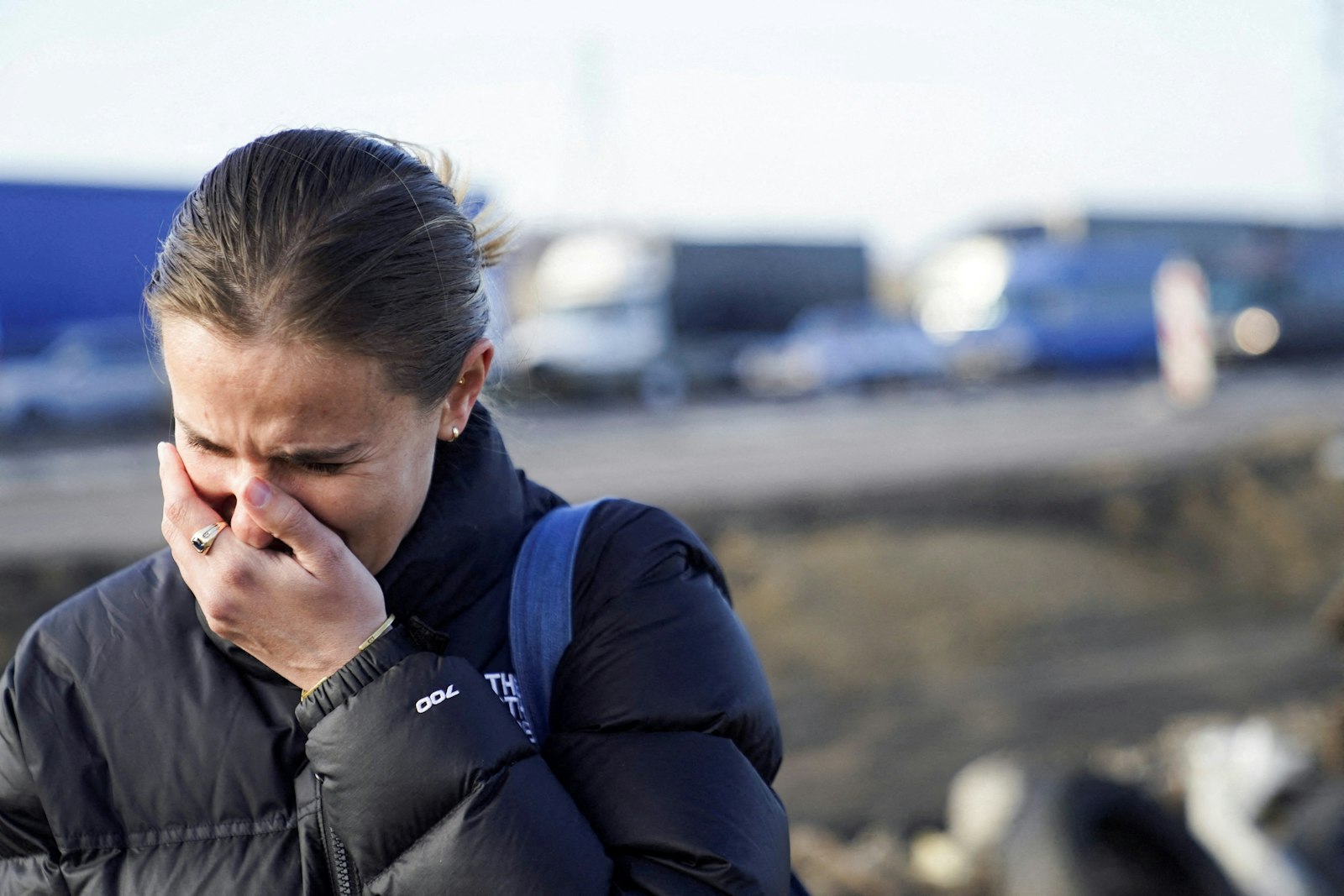 Pixie, who said she was U.S. citizen but did not give her last name, cries after crossing the border into Medyka, Poland, Feb. 24, 2022, after fleeing the violence in Ukraine. (CNS photo/Bryan Woolston, Reuters)