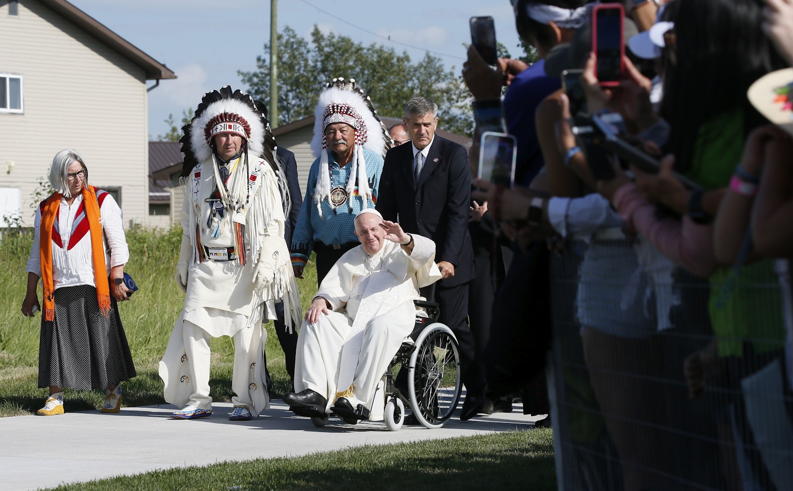 Pope Francis greets the crowd as he arrives at the Lac Ste. Anne pilgrimage and Liturgy of the Word in Lac Ste. Anne, Alberta, July 26, 2022. (CNS photo/Paul Haring)
