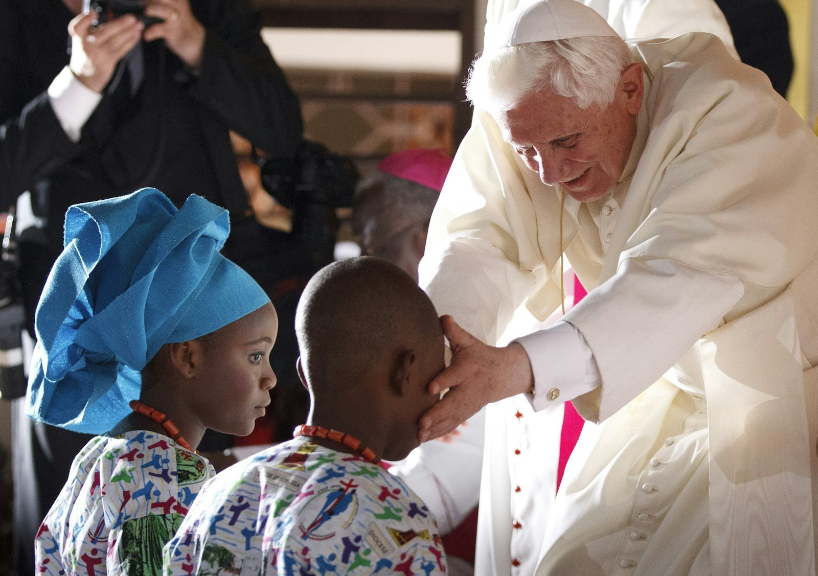 Pope Benedict XVI greets youths at the Missionaries of Charity Peace and Joy Center in Cotonou, Benin, Nov. 19, 2011. (CNS photo/Paul Haring)