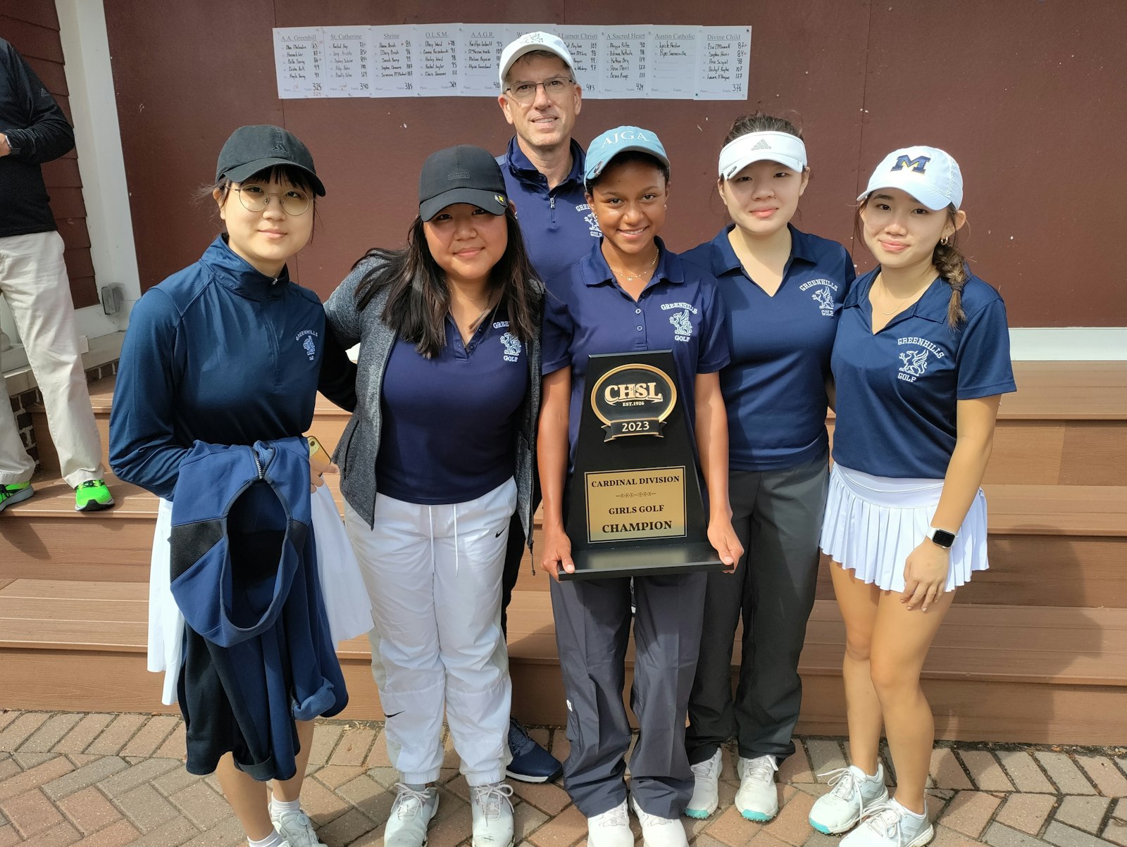 Mia Melendez holds the plaque proclaiming Ann Arbor Greenhills as CHSL 2023 Cardinal Division girls golf champs. Melendez won medalist honors with a 4-under 65 on the Detroit Golf Club South Course. Elisha Park and Hannah Lee on Melendez’s left and Bella Young and Kayla Young on her right round out the Gryphons team coached by Michael Karr.