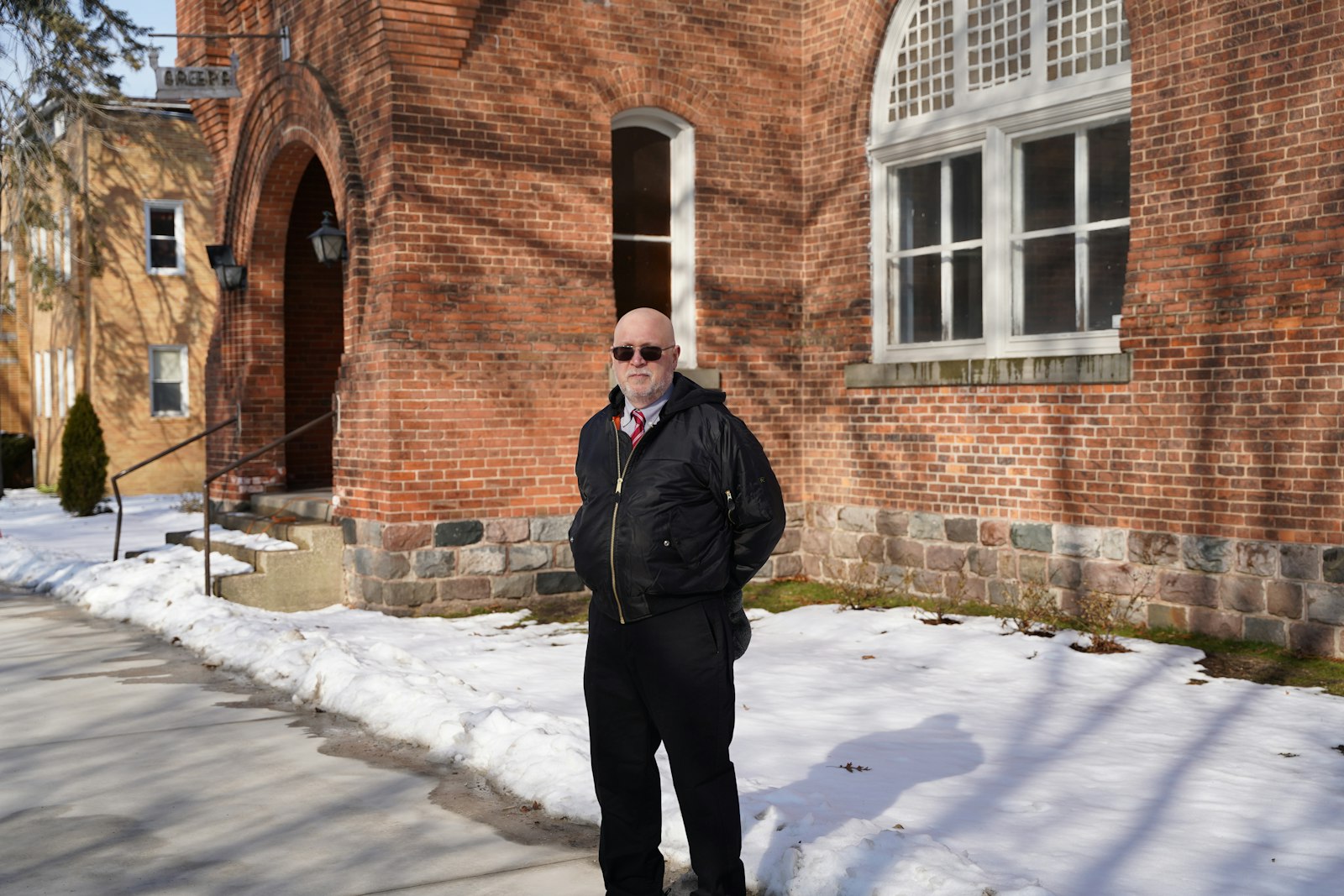 John Radzilowski, Ph.D., director of the Polish Institute for Culture and Research at the Orchard Lake Schools, stands outside the campus' Ark Building, which houses many cultural artifacts and records. Radzilowski wants to better employ the school's artifacts and records by making them more accessible to the public.