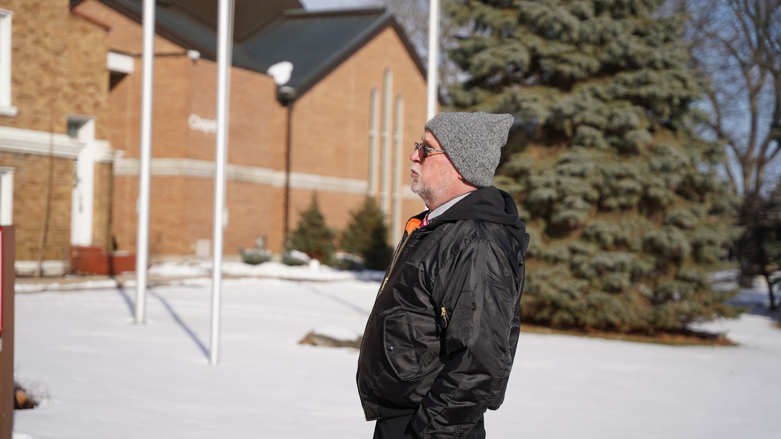 John Radzilowski, Ph.D., director of the Polish Institute for Culture and Research, stands outside the Chapel of Our Lady of Orchard Lake.