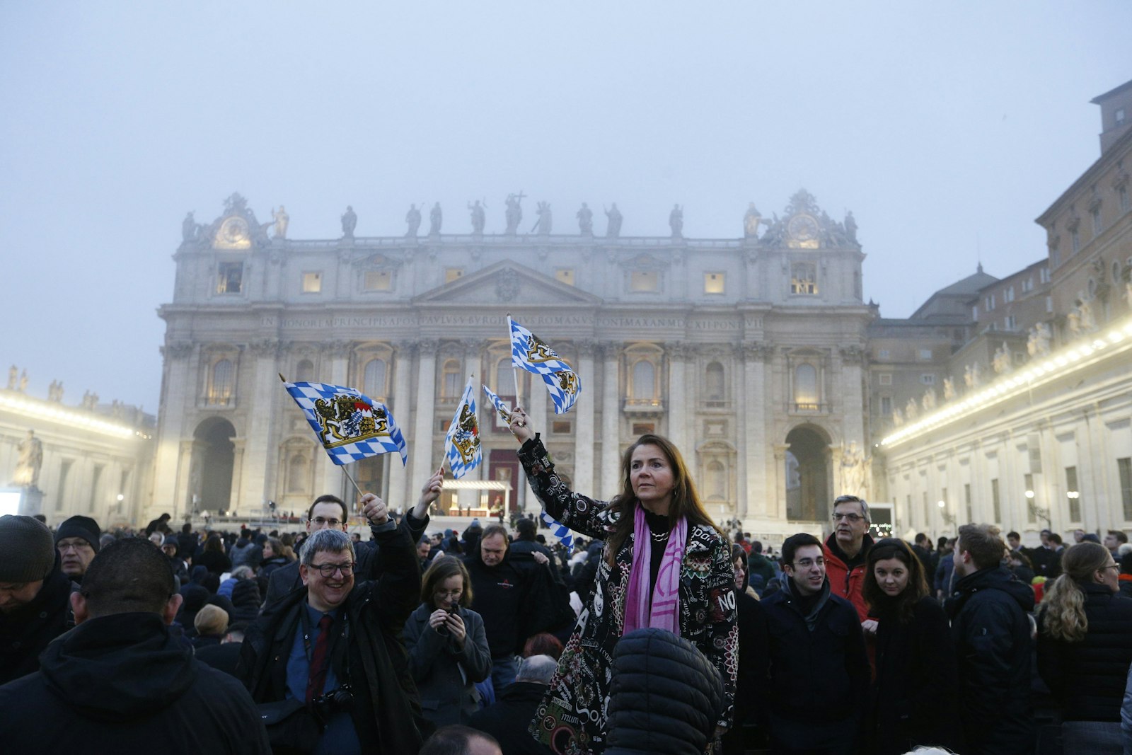 Pilgrims wave Bavarian flags in St. Peter's Square at the Vatican before Pope Francis' celebration of the funeral Mass of Pope Benedict XVI Jan. 5, 2023. (CNS photo/Paul Haring)