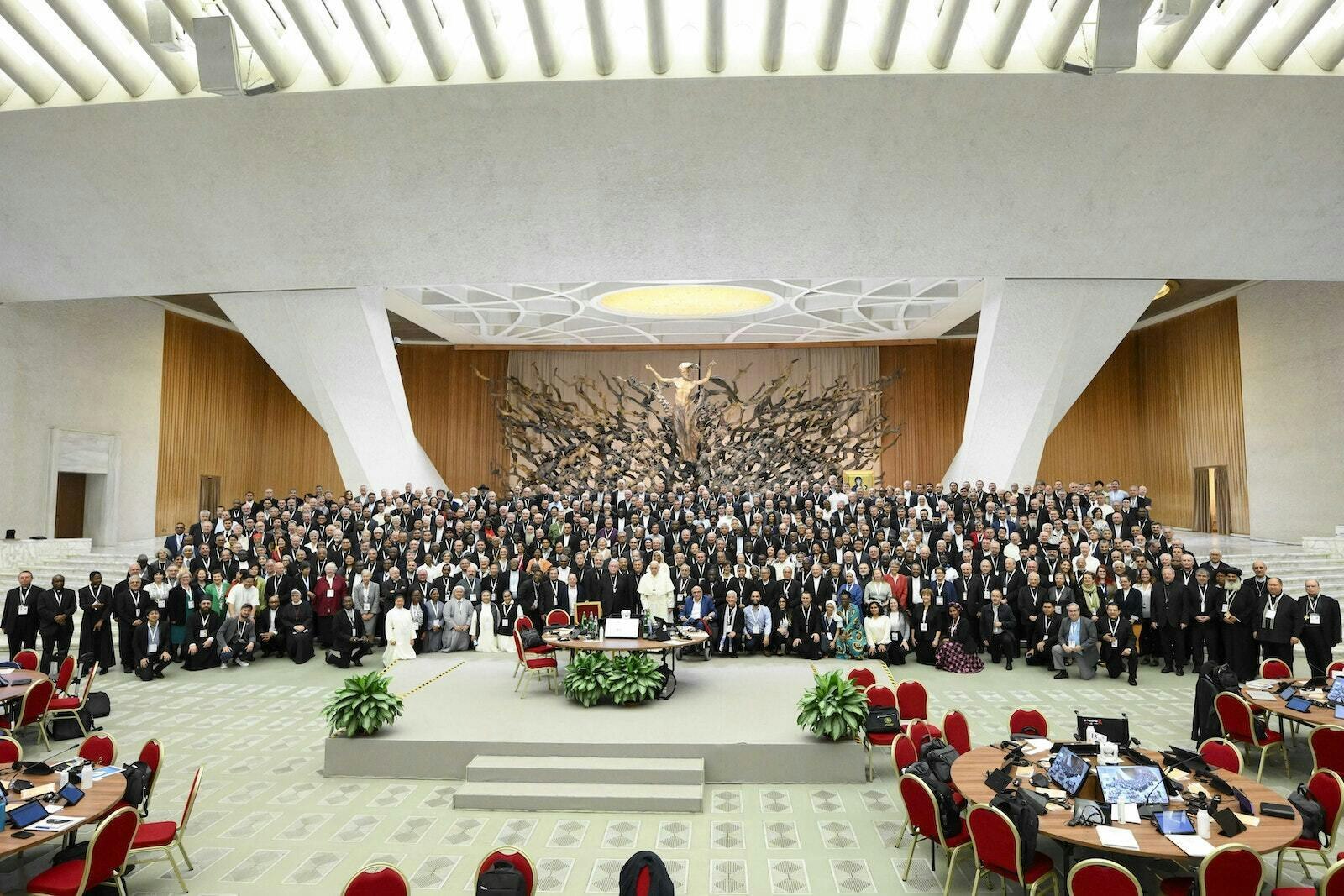 Pope Francis poses for a photo with participants in the assembly of the Synod of Bishops before a working session in the Paul VI Audience Hall at the Vatican Oct 23, 2023. Urquidi, who spent a month in Rome with other synod delegates from around the world, is pictured in the front row near the left. (Vatican Media | CNS photo)