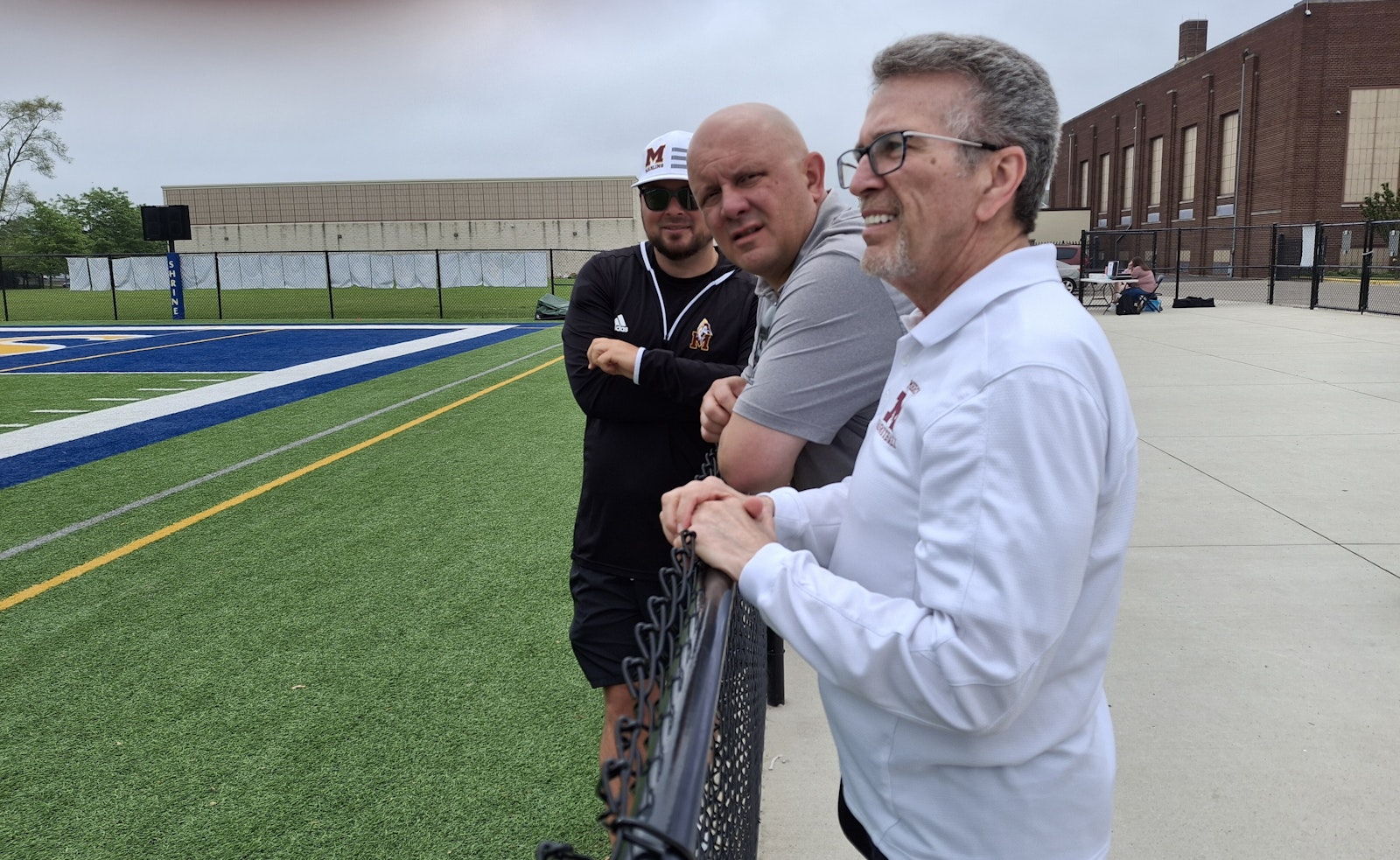 Mercy athletic director Brandon Malinowski (far left), CHSL associate director Mike Evoy and Mercy basketball coach Gary Morris shared a variety of opinions during the girls soccer championship games.