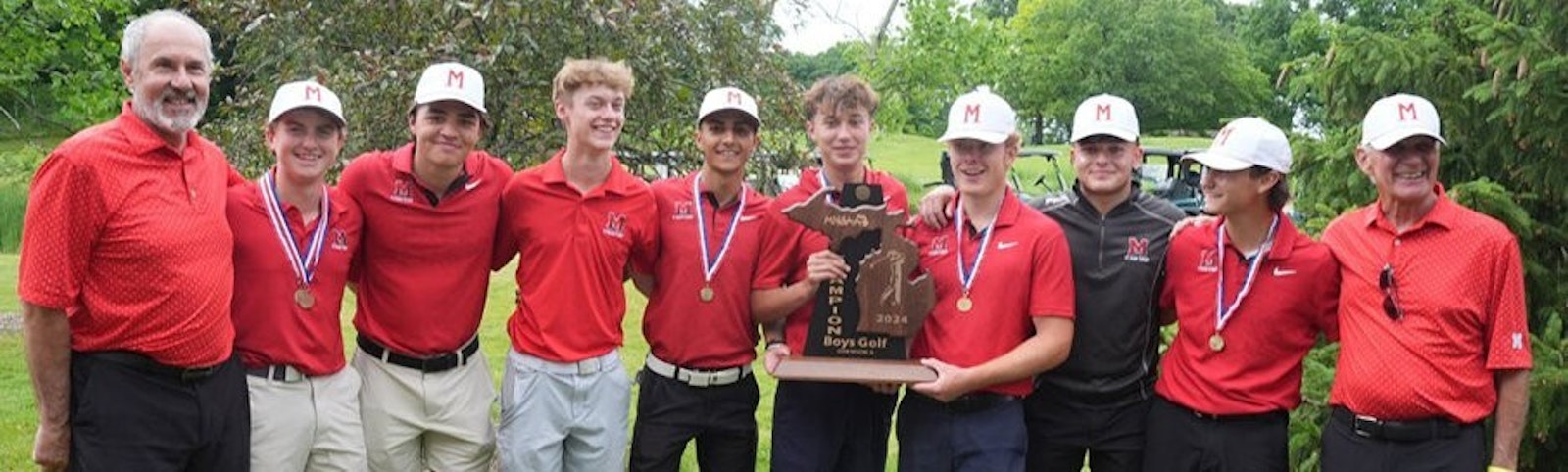 Tom Brecht (left) has coached St. Mary’s Prep golf team for 26 years. “I thought it would come,” he said about the Eaglets winning the school’s first golf championship. St. Mary’s won by one stroke in a tense two-day scramble among three teams. (Photo courtesy MHSAA)