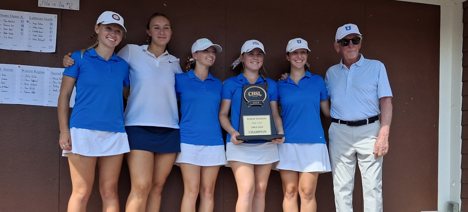 Greenhills won the CHSL Cardinal Division girls golf trophy for the second year in a row. Claiming the prize are, left to right, CC Jarjoura, Hannah Lee, Mia Melendez, Kayla Young. Saaya Doshi and coach Mike Karr. Melendez (holding the trophy in the white skirt) shot a brilliant 63. (Photo by Don Horkey | Special to Detroit Catholic)