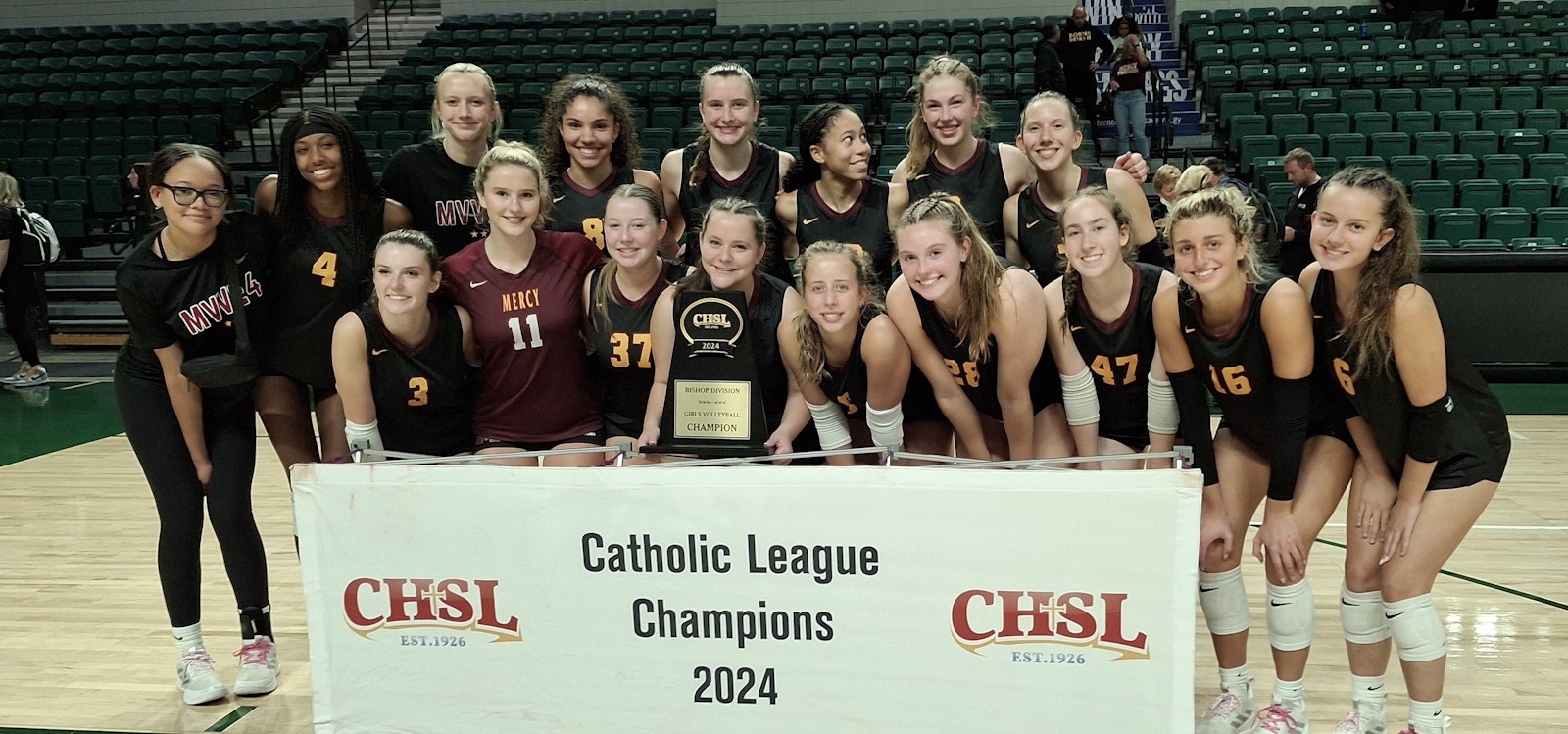 Farmington Hills Mercy won its first CHSL girls volleyball Bishop Division trophy in five years by defeating archrival Bloomfield Hills Marian, winner the last four years. (Don Horkey | Special to Detroit Catholic)