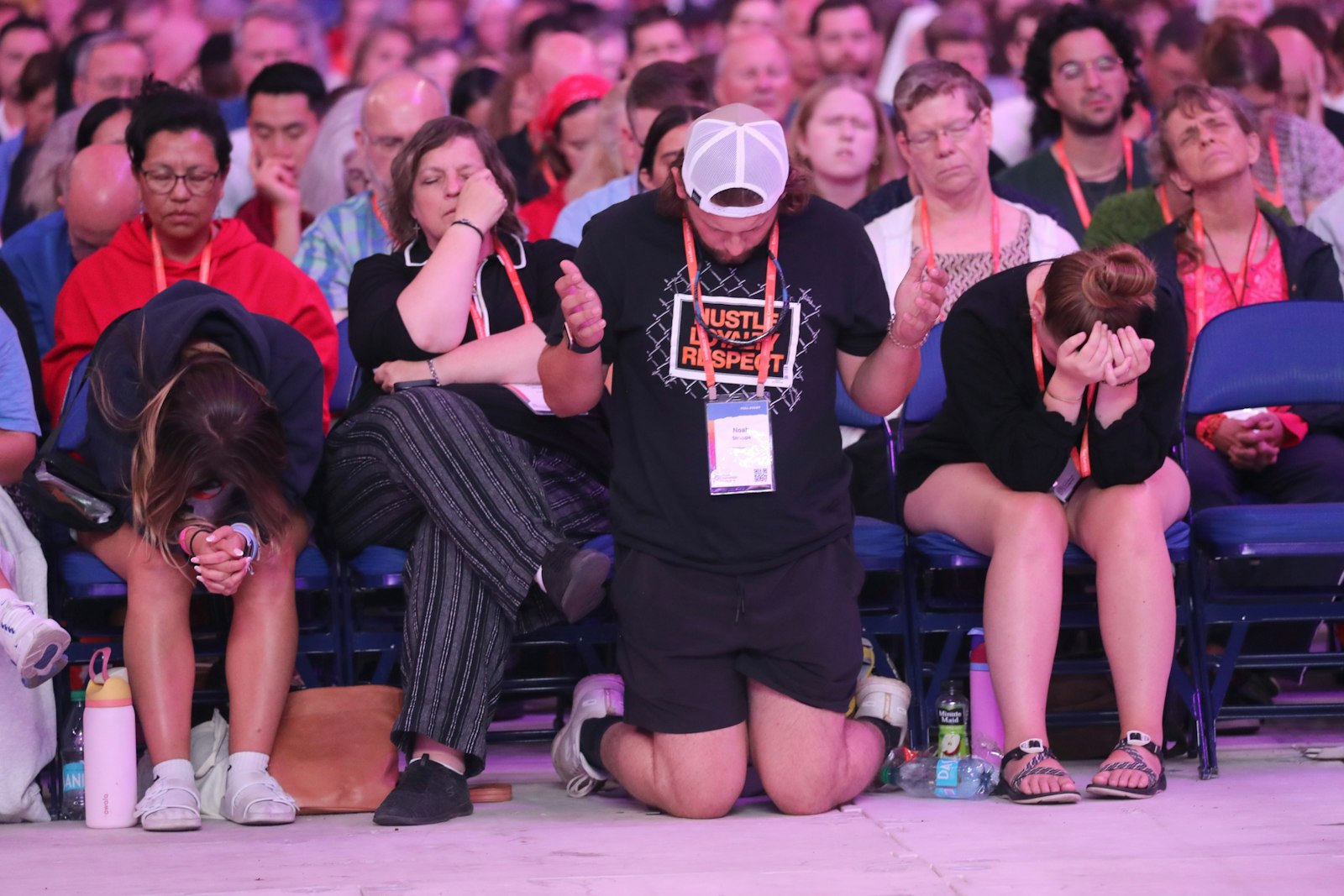 Pilgrims pray during a July 19, 2024, Encounter impact session at Lucas Oil Stadium during the National Eucharistic Congress in Indianapolis. (OSV News photo/Bob Roller)