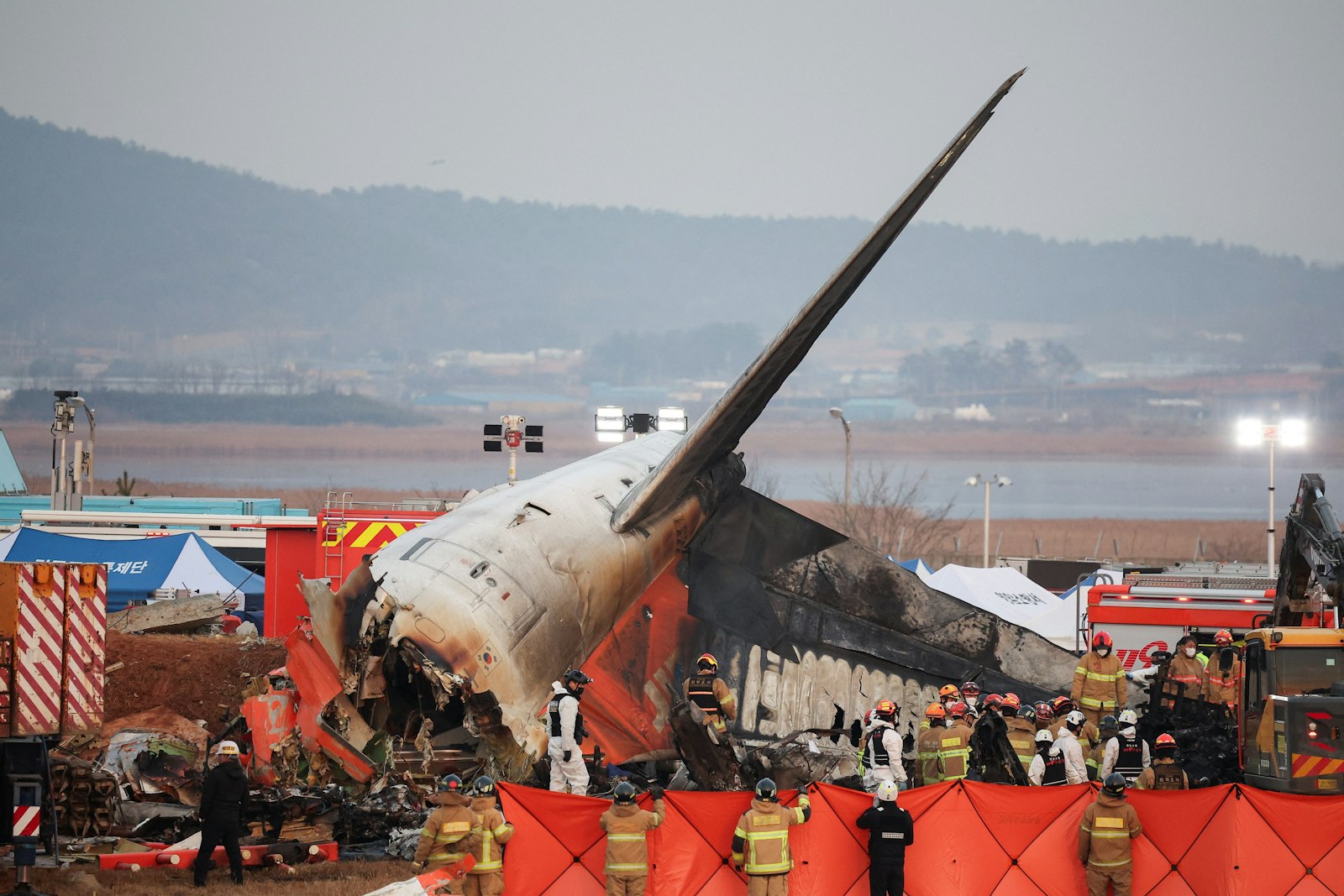 Rescue workers take part in a salvage operation at the site where a plane crashed after running off the runway at Muan International Airport in South Korea, December 29, 2024. (OSV News Photo/Kim Hong-Ji, Reuters)