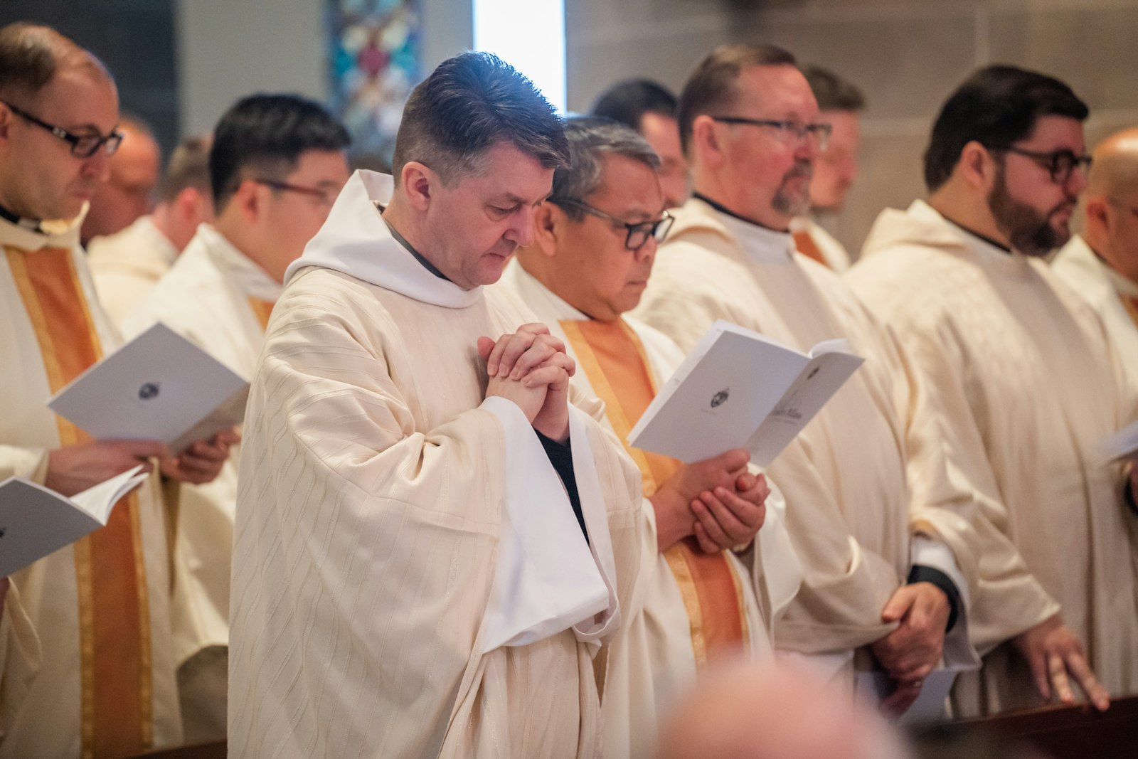 Priests of the Archdiocese of Detroit renew their priestly promises on Holy Thursday, which commemorates Christ's institution of the priesthood during the Last Supper.