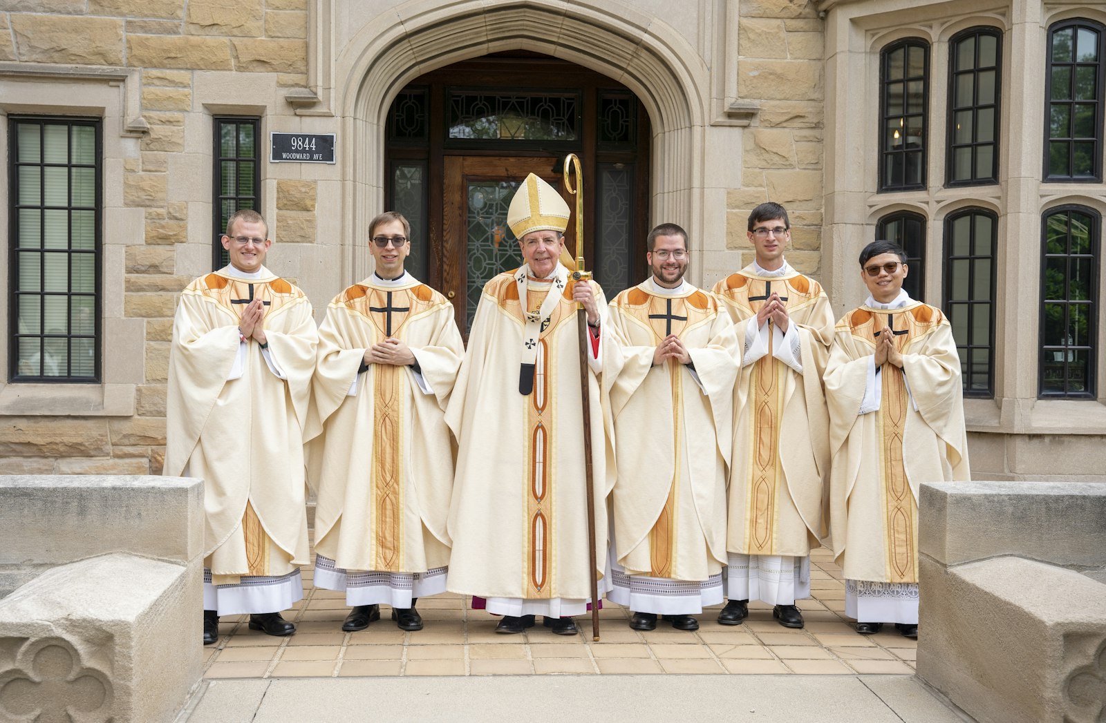 Archbishop Allen H. Vigneron, center, stands with five new priests ordained May 18 for the Archdiocese of Detroit at the Cathedral of the Most Blessed Sacrament. Left to right, the new priests are Fr. Matthew Kurt, 28, Fr. Nicholas Brown, 31, Fr. Stephen Moening, 27, Fr. Ryan Asher, 27, and Fr. Phuc (Tommy) Ngo, 31. (Photos by Valaurian Waller | Detroit Catholic)