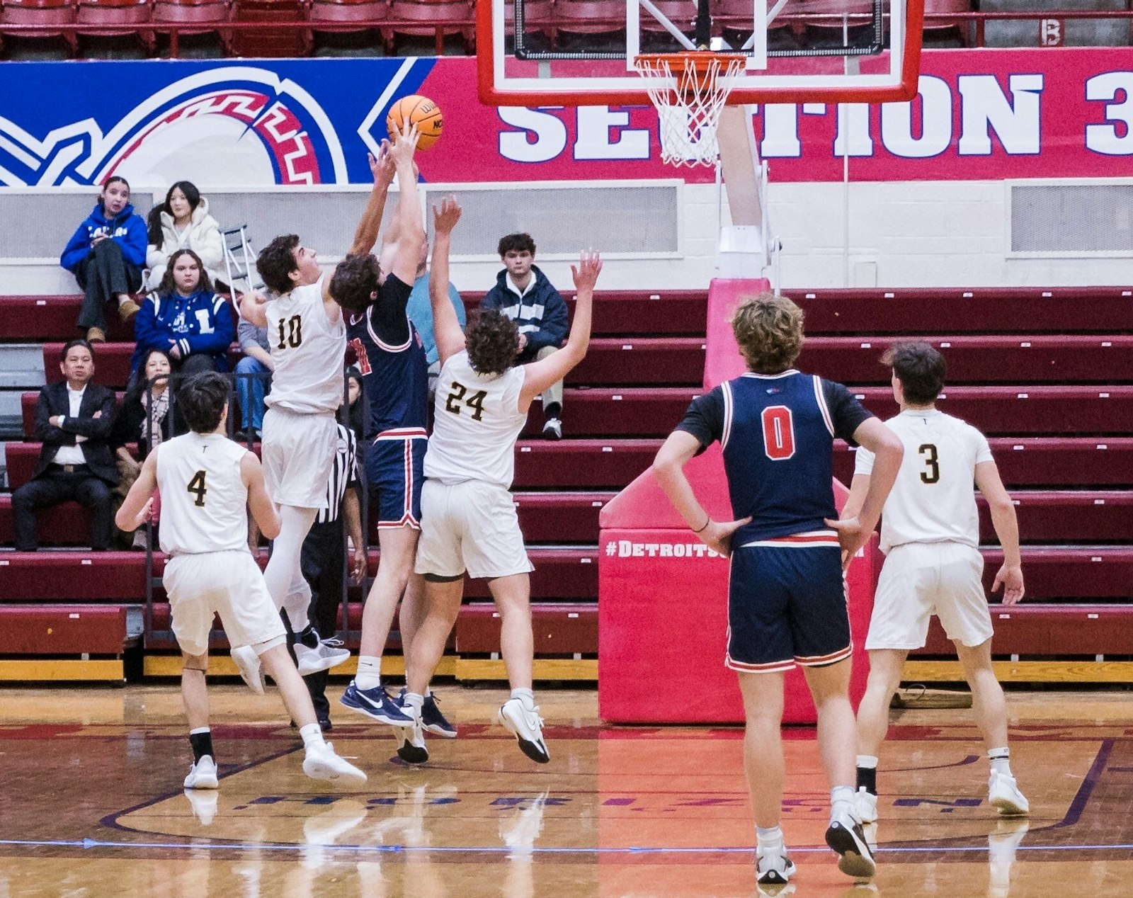 Mark Cross (10) fights for a rebound in Everest Collegiate’s game against University Liggett for the CHSL Ste. Anne Division title. He hustled from start to finish in what was his last high school basketball game.