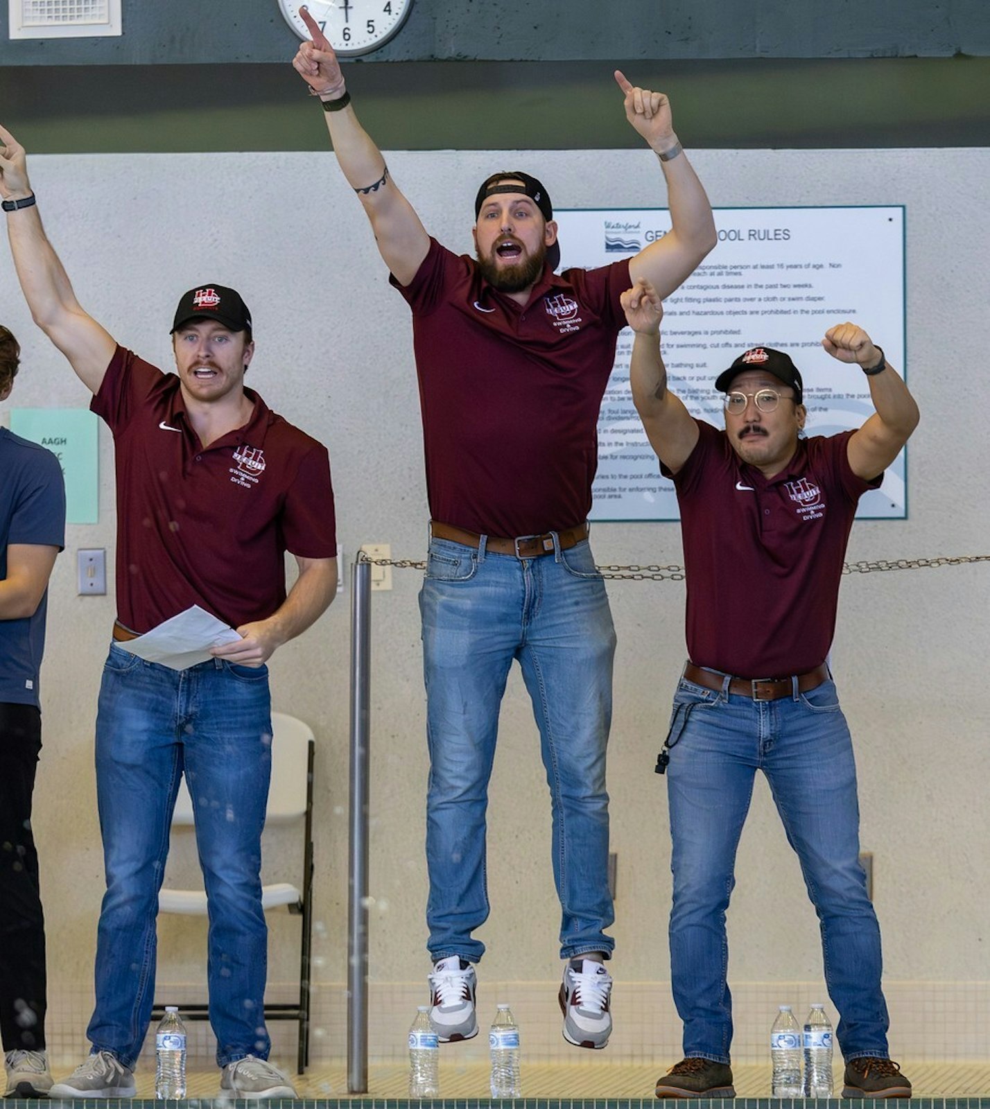 No one was more involved in the drama of University of Detroit Jesuit’s winning the CHSL boys swim title than head coach Drew Edson (in the center) and assistant coaches Henry Van Fassien (on the left) and Eric Schuma. Edson has coached the Cubs for nine years. (Photo courtesy of Steve Tack)