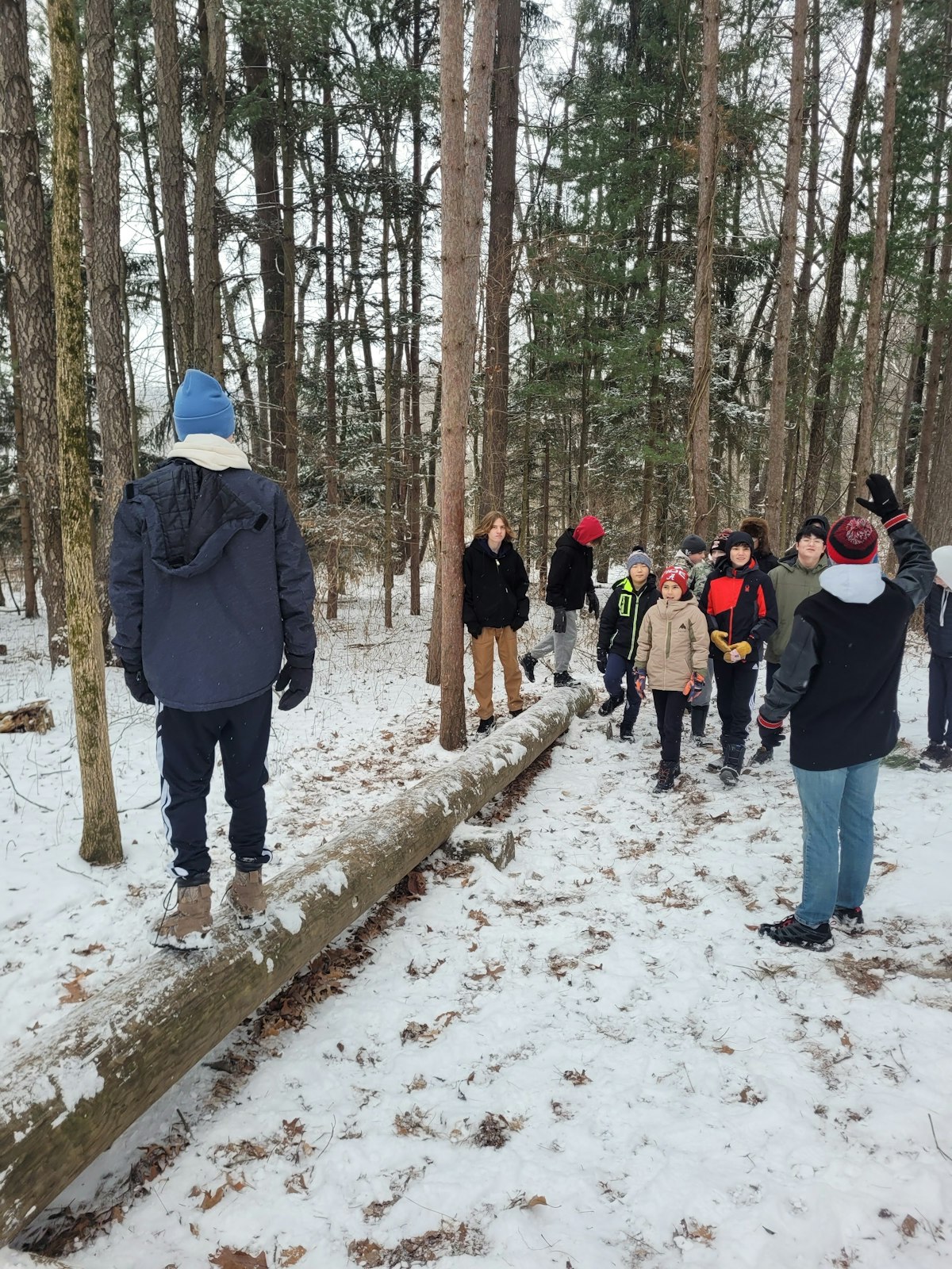 Young people participate in group activities outside in the snow at Our Lady of the Fields Camp in Brighton. The year-round camp offers opportunities for prayer, fellowship and team-building in a fun atmosphere surrounded by natural beauty.