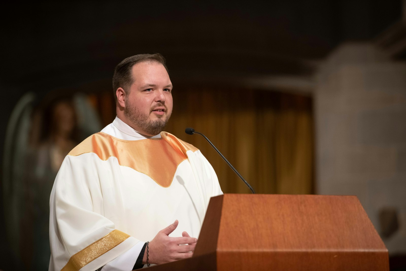 Deacon Andrew Smith delivers a thank-you address after his ordination to the transitional diaconate on behalf of his classmates. Deacon Smith said two visits to World Youth Day, as well as hours spent in Eucharistic adoration, confirmed his vocation.