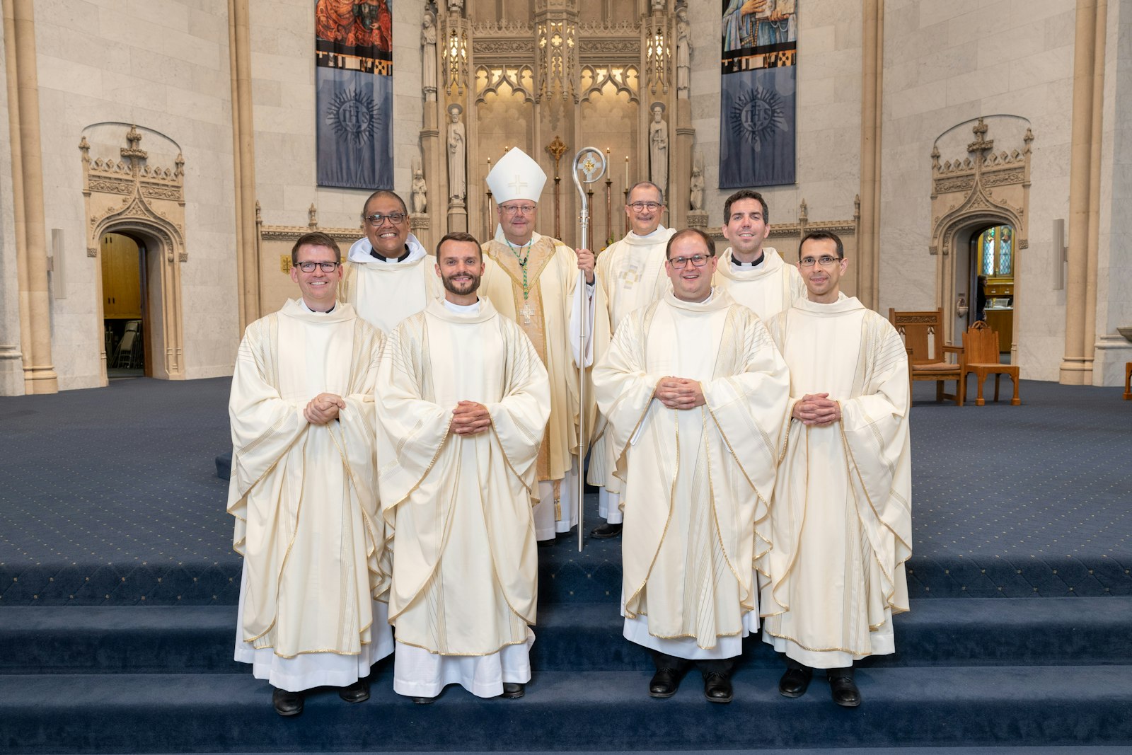 The Midwest Jesuits ordained six men to priestly ministry on June 10 at the Church of the Gesu in Milwaukee. Left to right are Fr. Daniel J. Dixon, SJ; Fr. Damian G. Torres-Botello, SJ; Fr. Aaron W. Pierre, SJ; 
Cleveland Bishop Edward C. Malesic; Fr. Karl J. Kiser, SJ, provincial of the Midwest Province Jesuits; Fr. Daniel J. Kennedy, SJ; Fr. Nicholas A. Albin, SJ; and Fr. Andrea Bianchini, SJ. (Steve Donisch | Special to Detroit Catholic)