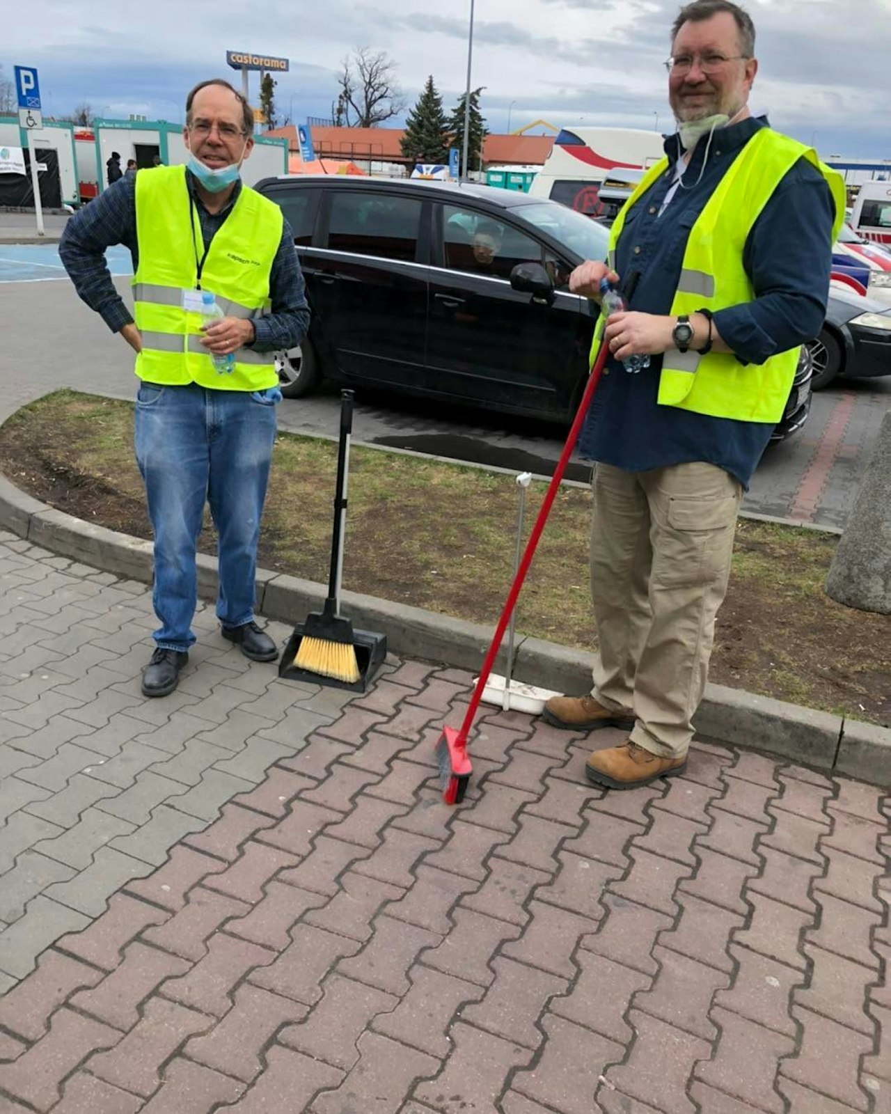 Mike McDevitt, left, works alongside another volunteer at the Tesco Refugee Center. McDevitt said spending 10 days in service of Ukrainian refugees reminded him of the value of compassion and of being present to others.