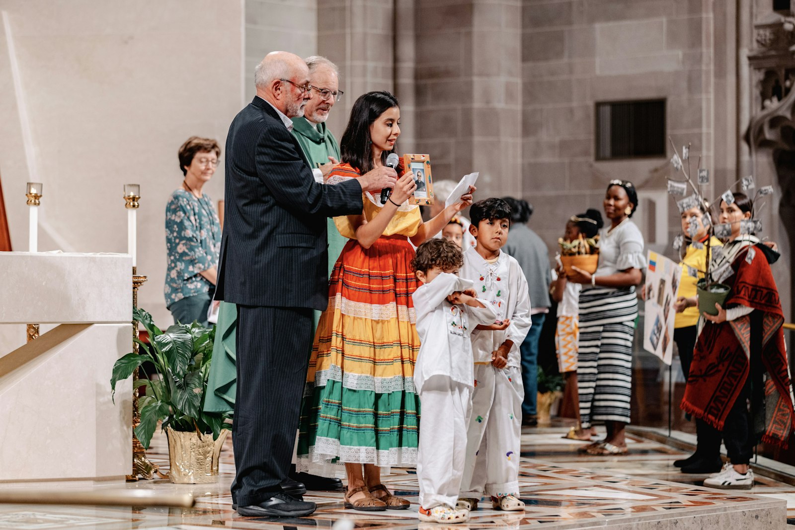 Migrants and immigrants from various communities across Metro Detroit shared their experiences and gratitude coming to the United States during the offertory.