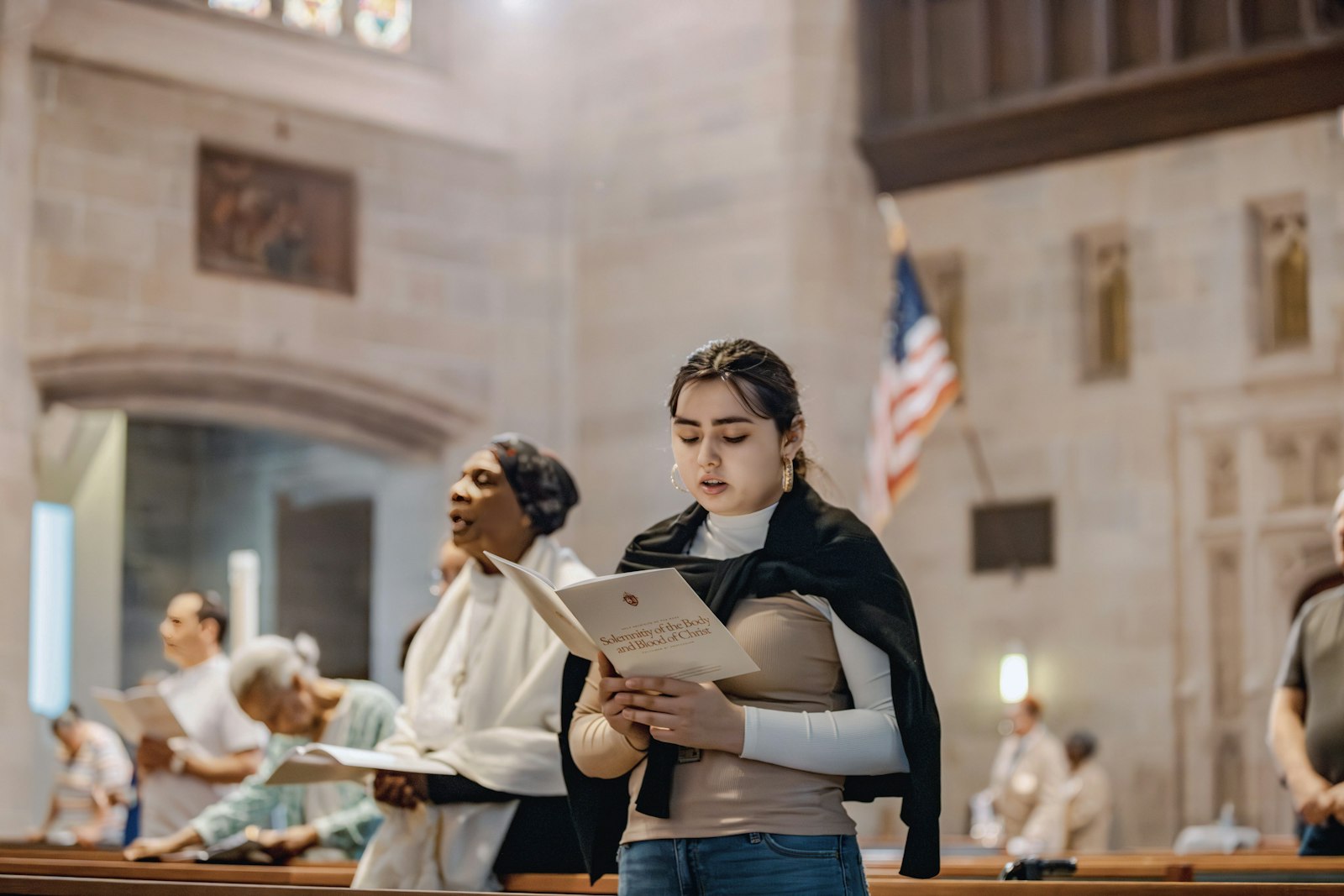 Massgoers sing Pluth's and Johnson's hymns during the feast of Corpus Christi, June 11, at the Cathedral of the Most Blessed Sacrament in Detroit. (Alissa Tuttle | Special to Detroit Catholic)