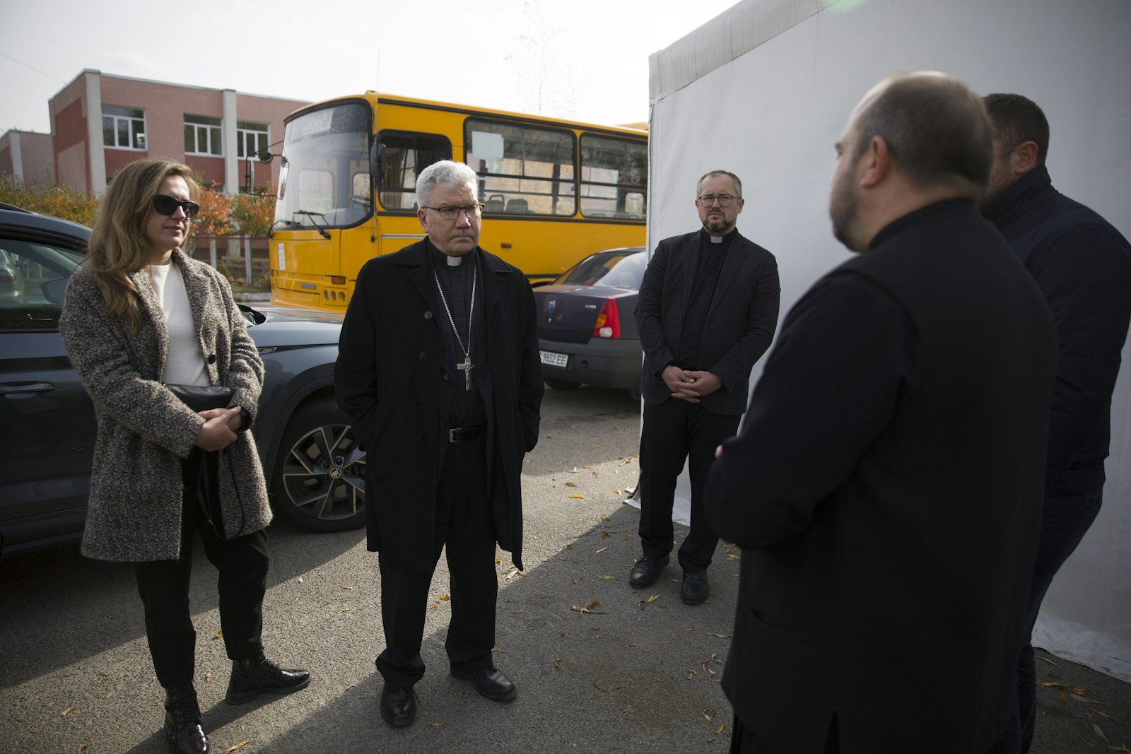 Bishop Monforton speaks with Ukrainian clergy and aid workers outside a makeshift shelter providing heat, internet access and essentials to displaced families in Kiev, Ukraine.