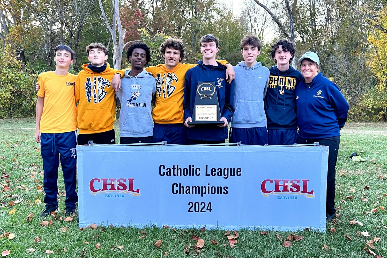 Royal Oak Shrine’s boys celebrate their first Catholic League cross-country title in 10 years. The Knights topped the 10-team field at Willow Metropark near New Boston on Oct. 19. (Photo courtesy of Shrine High School)