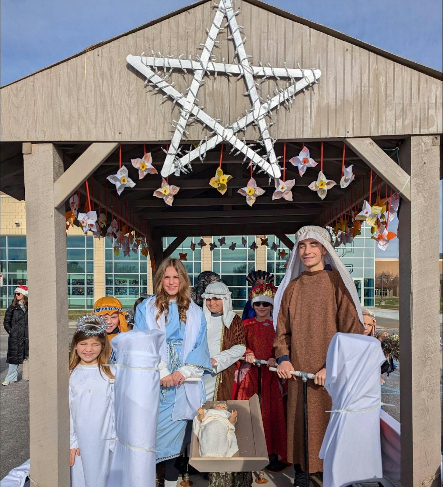 Izzi said the school offers all students the opportunity to participate in the float, but even those who don’t want to march in the parade get to play a part. This year, Izzi said that in addition to the angels, sheep, and shepherds, the float carried three sets of kings. Two eighth graders were cast in the roles of Joseph and Mary.