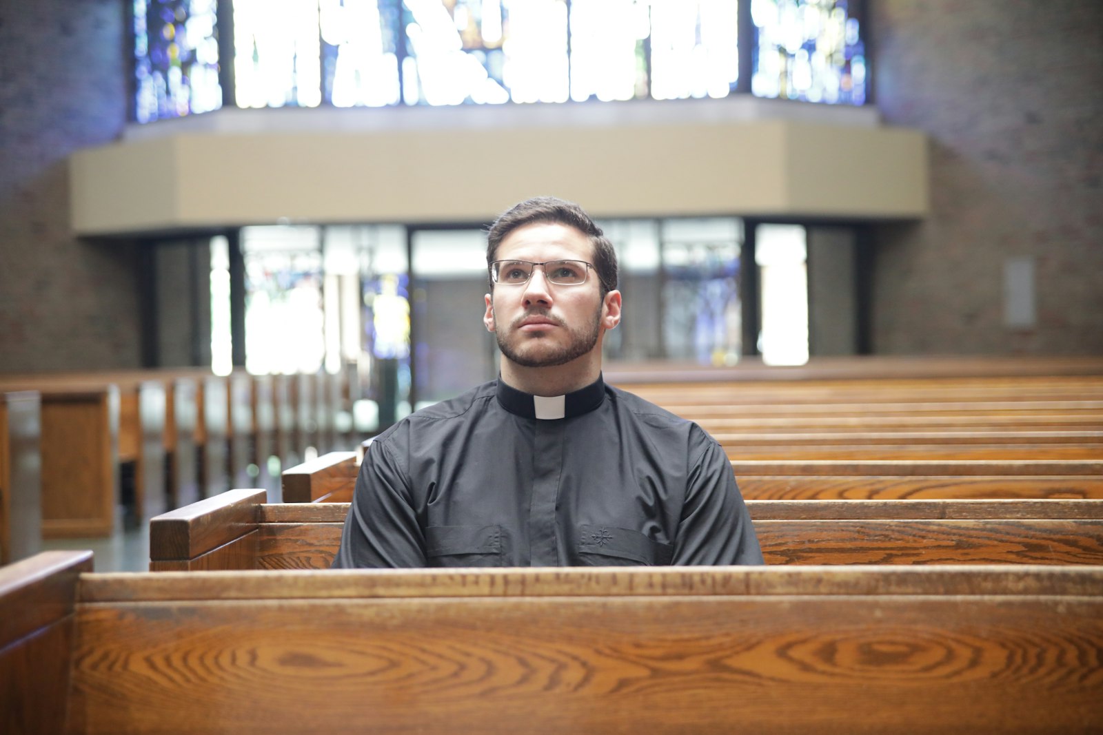 Transitional Deacon Jeremy Schupbach, who is assigned to St. Frances Cabrini Parish in Allen Park for the summer, sits in contemplation at the parish. Deacon Schupbach is helping organize a "24 Hours with the Lord" Eucharistic adoration event at the parish Aug. 4-5.