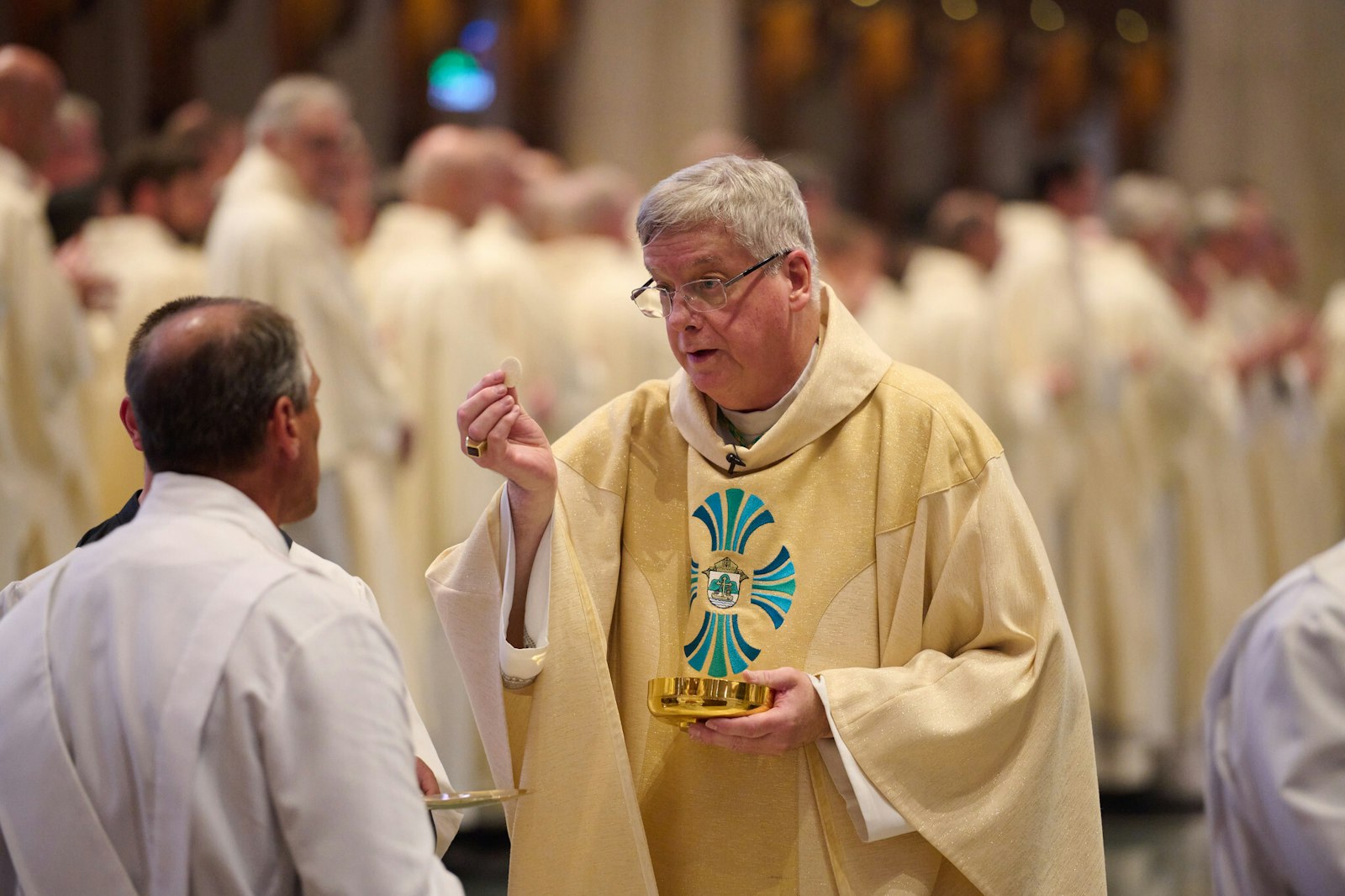 Bishop Battersby offers Communion for the first time as La Crosse's new bishop. The Detroit native and former Detroit auxiliary bishop spoke about the necessity of placing all of one's faith in Jesus during his installation Mass homily.