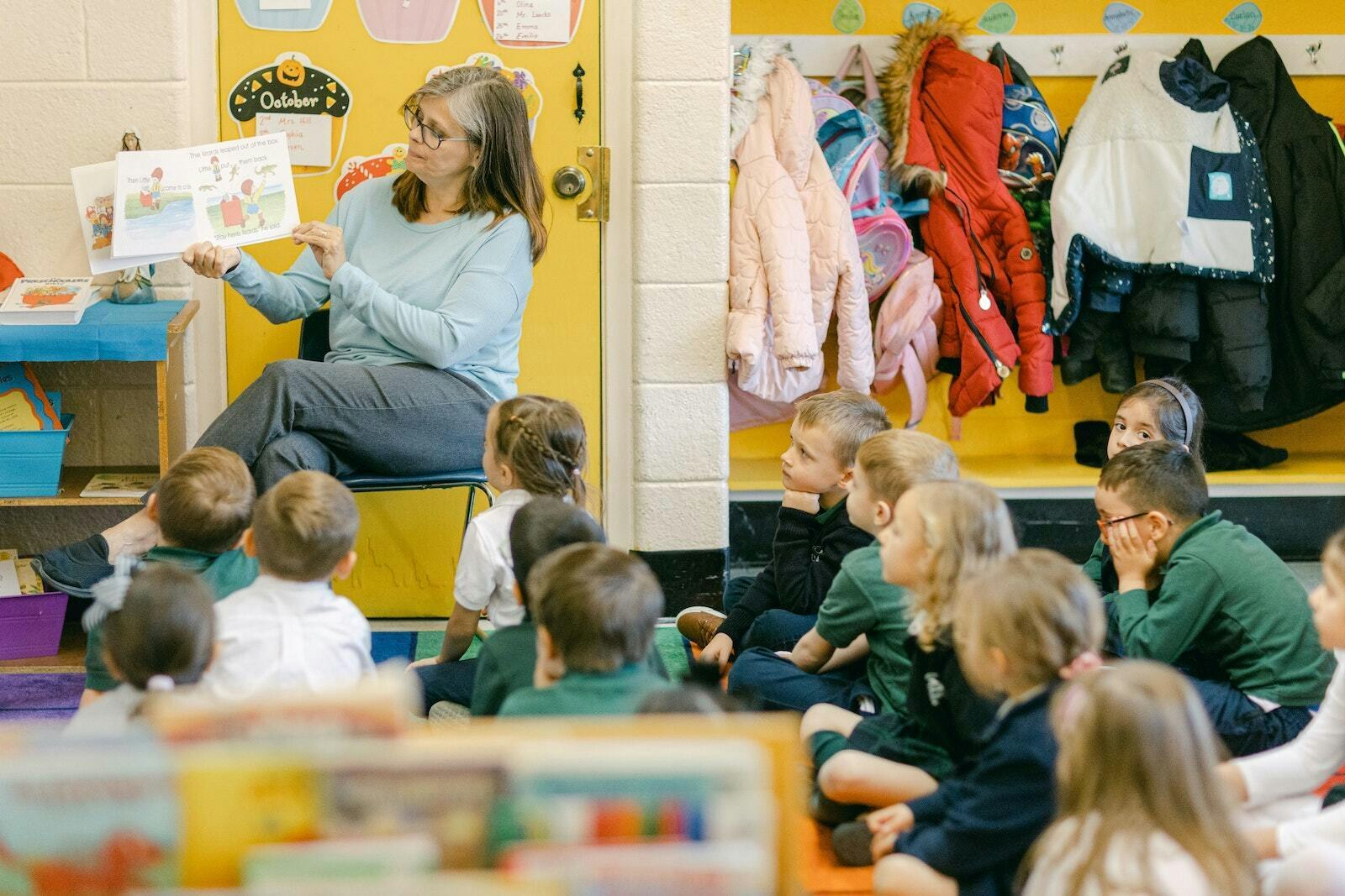 A teacher reads a book to her class at St. Anne Catholic School in Warren.
