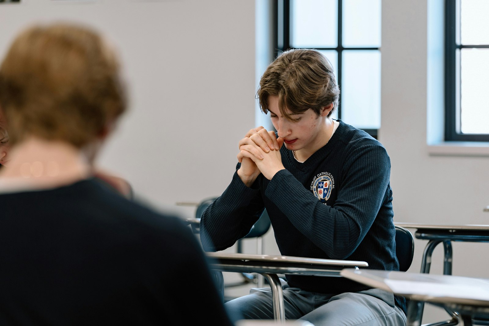 The program began in 2018, when a student approached theology teacher Colin Whitehead with a desire to become Catholic. That led to discussions with the school's administration about offering a formalized sacramental preparation program within the school, which was approved by Detroit Archbishop Allen H. Vigneron.