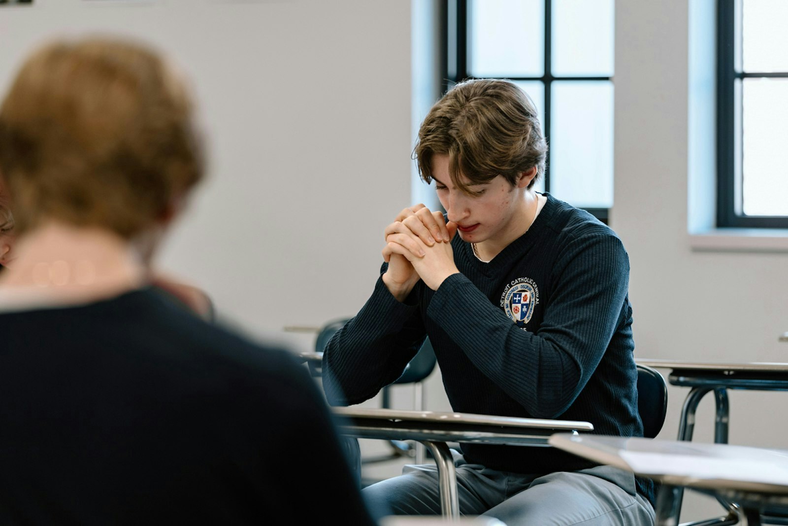 El programa comenzó en 2018, cuando un estudiante se acercó al profesor de teología Colin Whitehead con el deseo de convertirse al catolicismo. Esto dio lugar a conversaciones con la administración de la escuela sobre la posibilidad de ofrecer un programa formal de preparación sacramental dentro de la institución, lo cual fue aprobado por el Arzobispo de Detroit, Allen H. Vigneron.